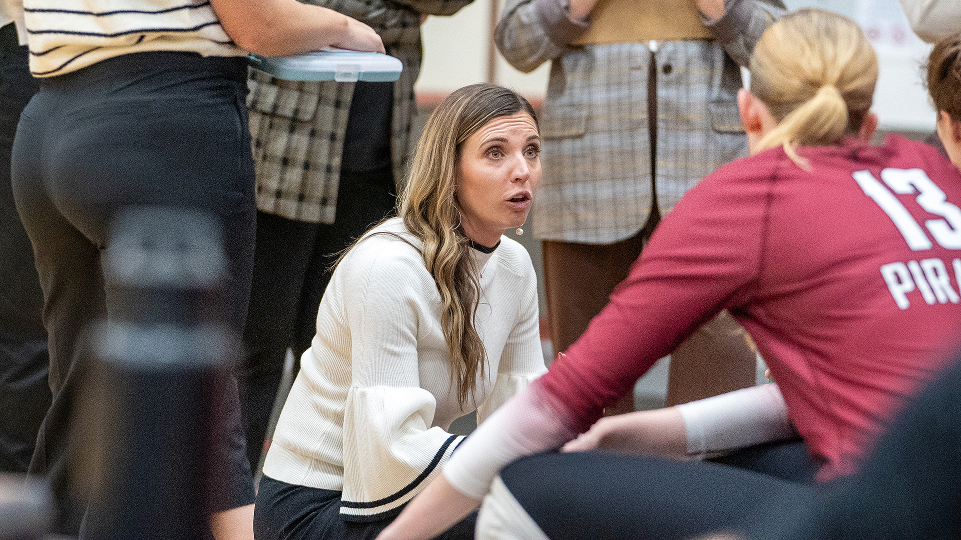 Kati Bodecker coaches during a timeout vs. Willamette