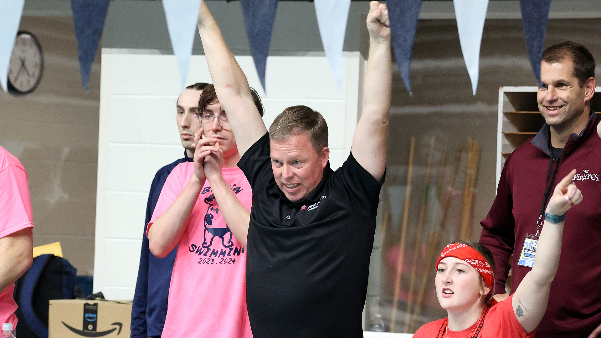 Steve Schadt cheers his swimmers during the women's 1,650 freestyle at the 2024 NWC Championships