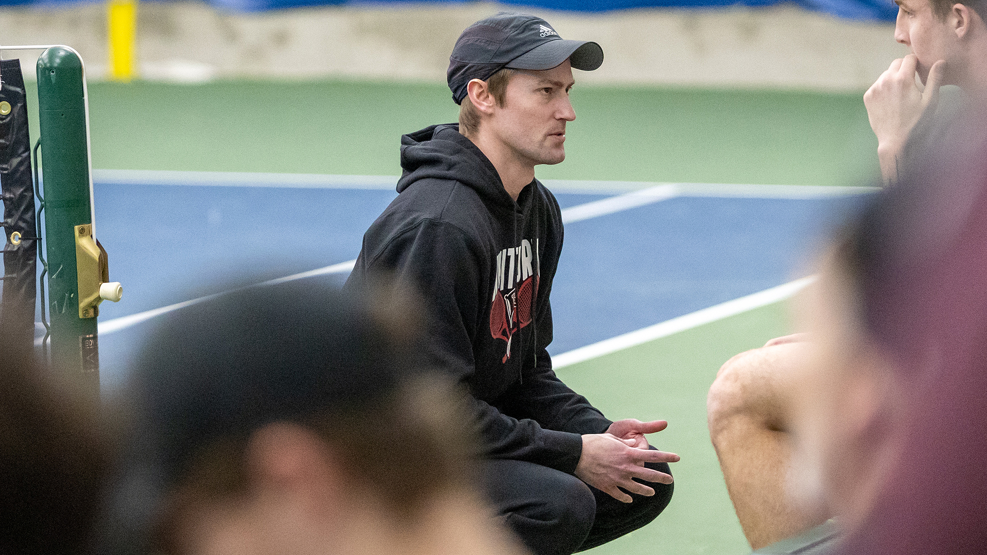 Daniel Redfern coaches his #1 doubles team vs. CC Spokane