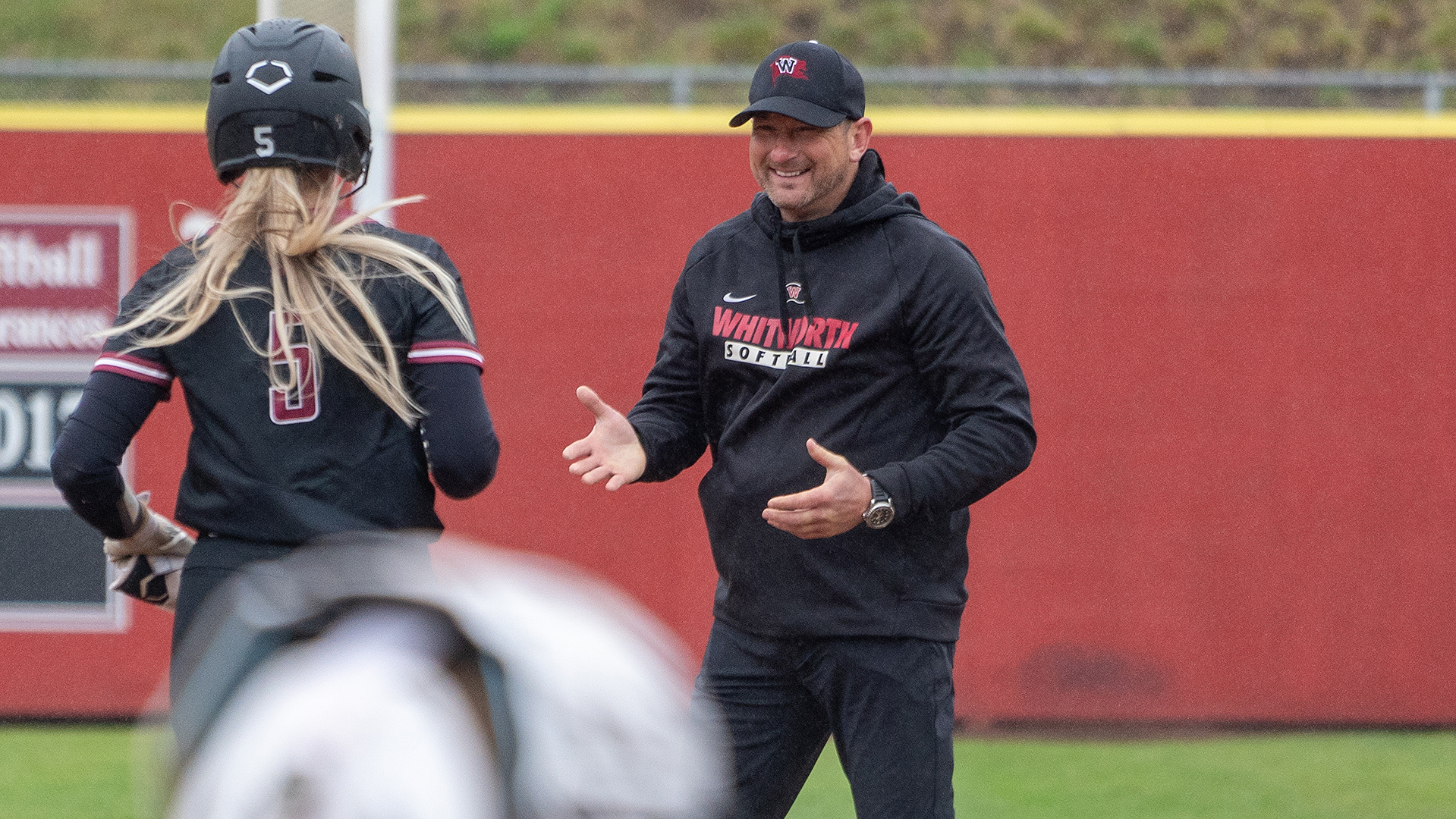 Head coach Bob Castle celebrates with Reagan Ellis vs. Pacific