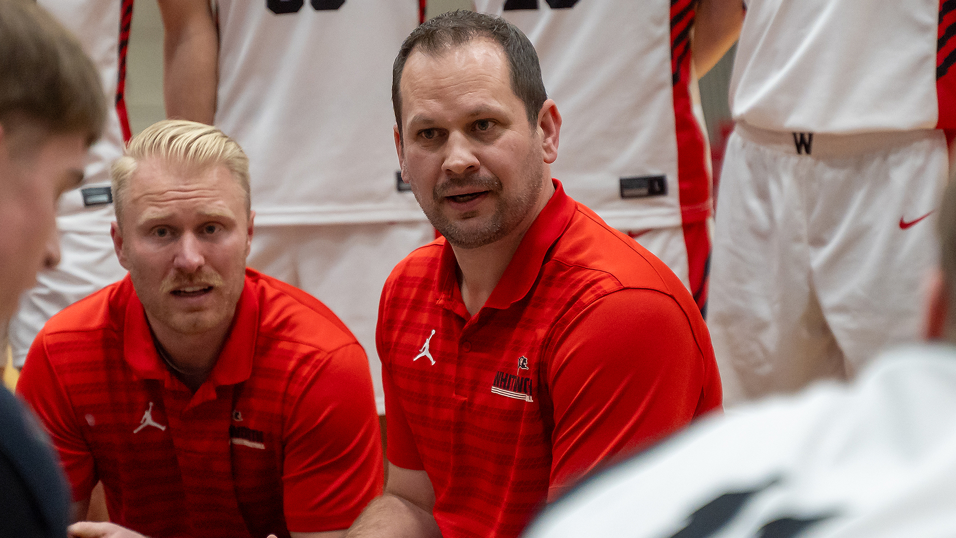 Damion Jablonski coaches during a first half timeout vs. Whitman