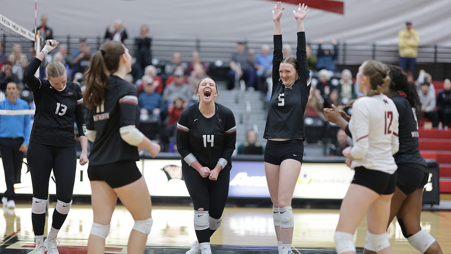 The Pirates celebrate a point vs. Willamette in the 2025 NWC Volleyball Semifinals