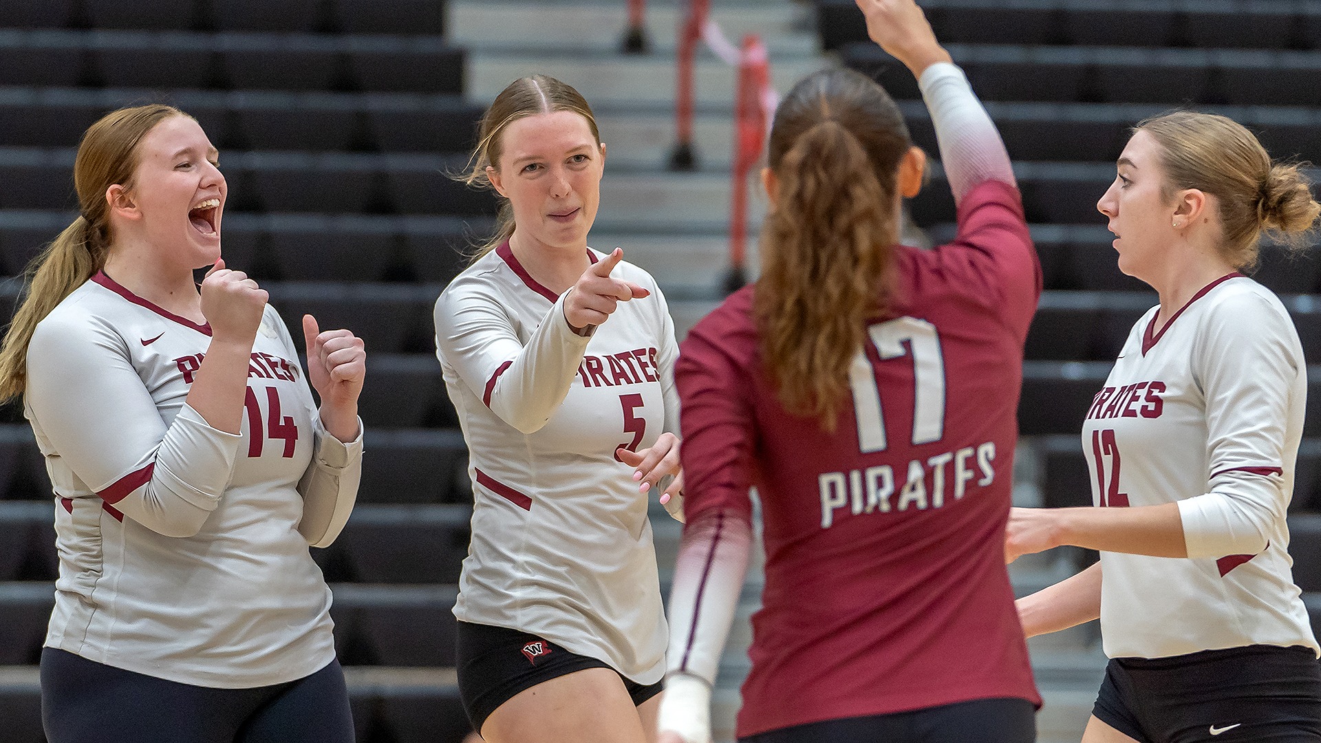 Lindsey Short celebrates a point with her teammates at Pacific (Ore.) 2025