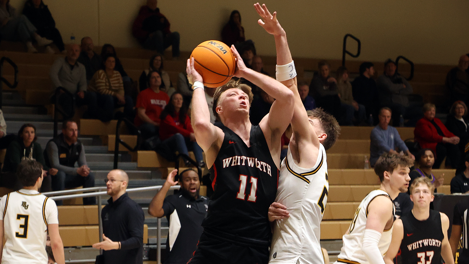 Ben Nyquist hits a tough basket in the paint at PLU