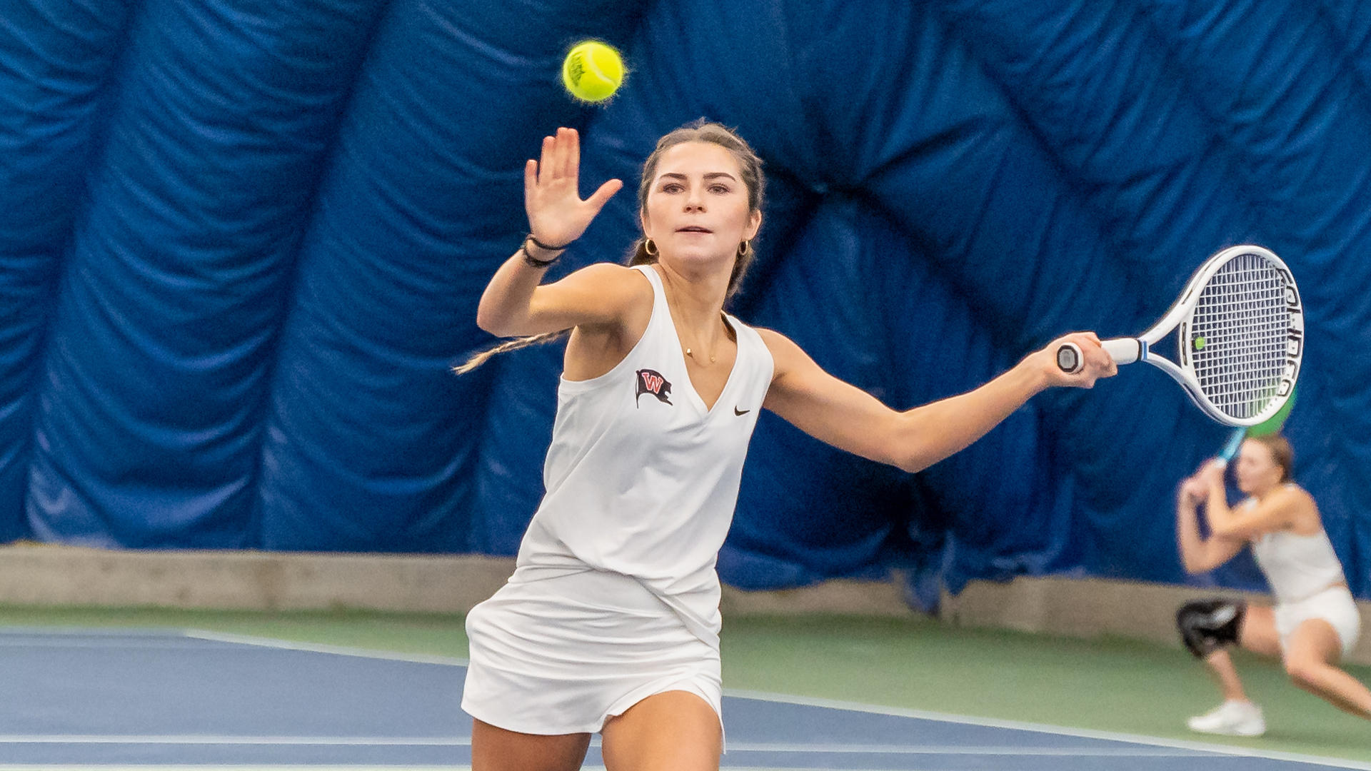 Paige Oliver lines up a forehand shot vs. Whitman