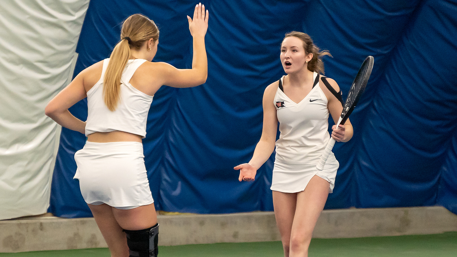 Clara Todd and Olivia Corbett celebrate a point vs. Whitman
