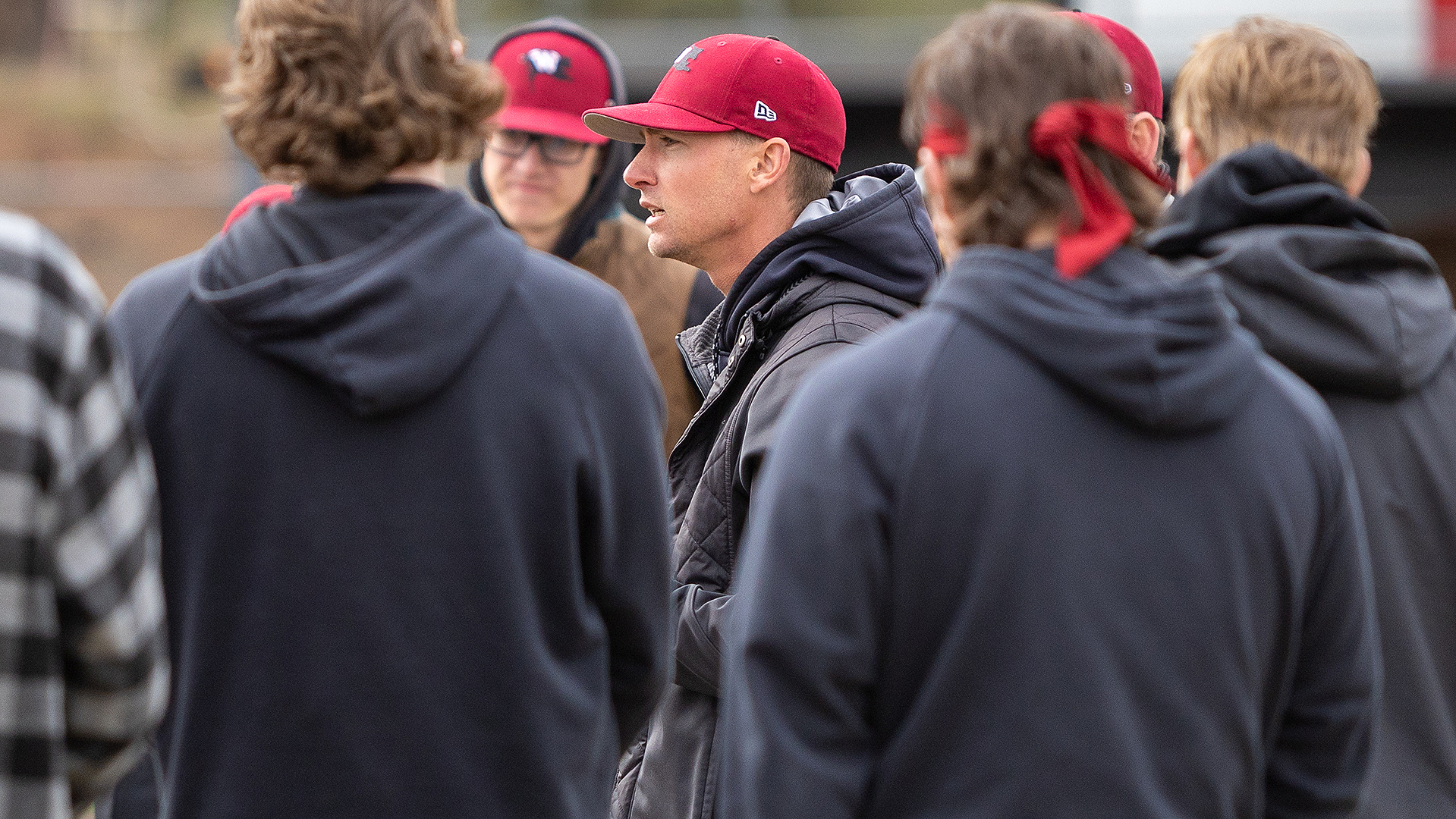 CJ Perry talks to the team between games vs. Saint Martin's