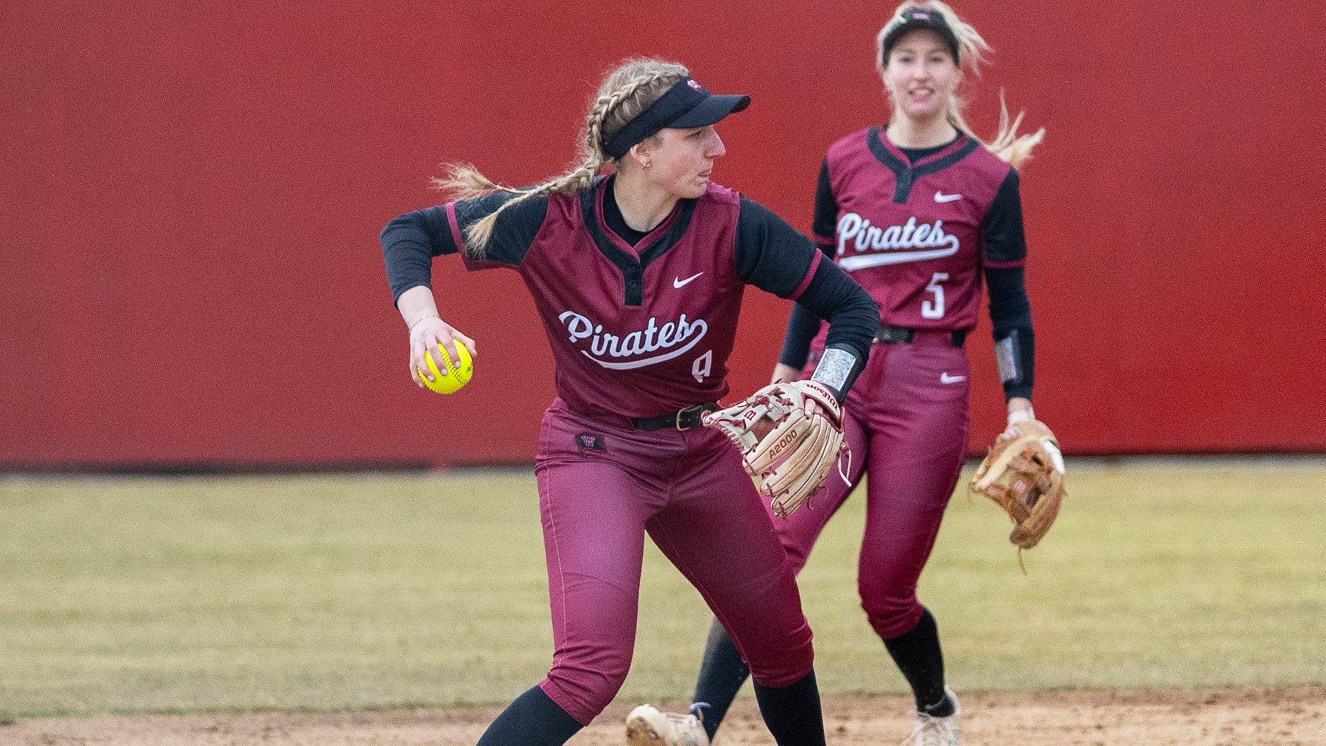 Reagan Ellis throws towards first base vs. Willamette