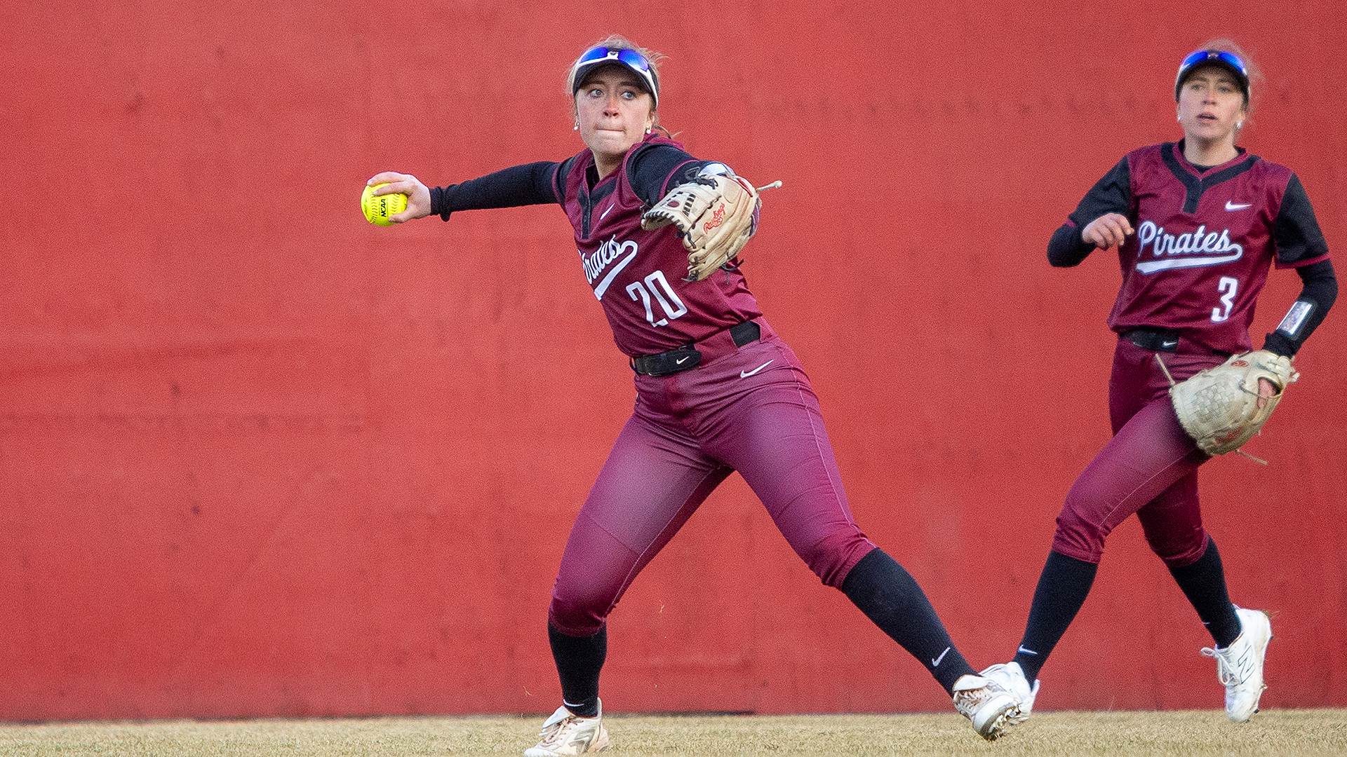 Camryn Sage makes a throw from the outfield vs Willamette