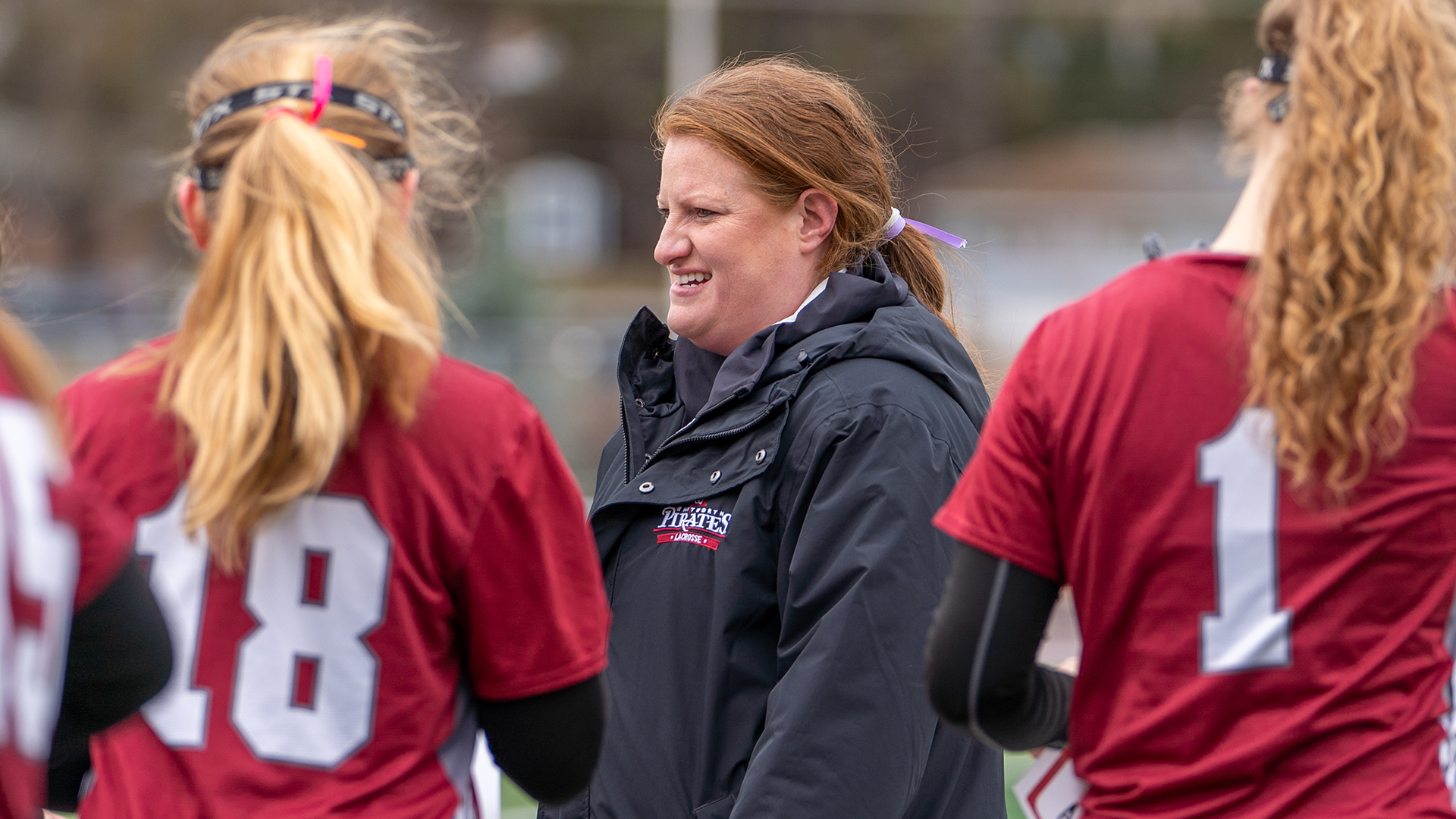 Noelle Brouillard coaches during a timeout vs. Whitman