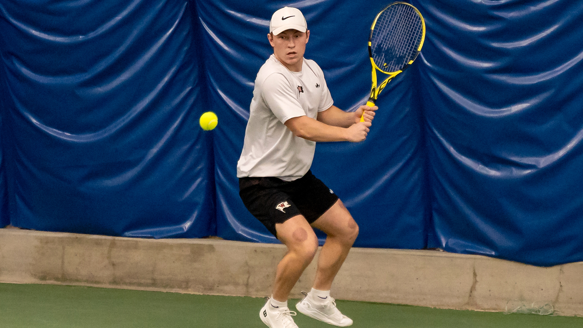 Matt Hossack sizes up a backhand vs. Whitman