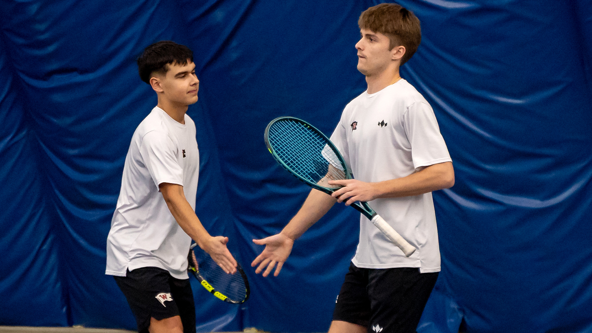 Matthew Morrison and Henry Preacher celebrate a point vs. Whitman