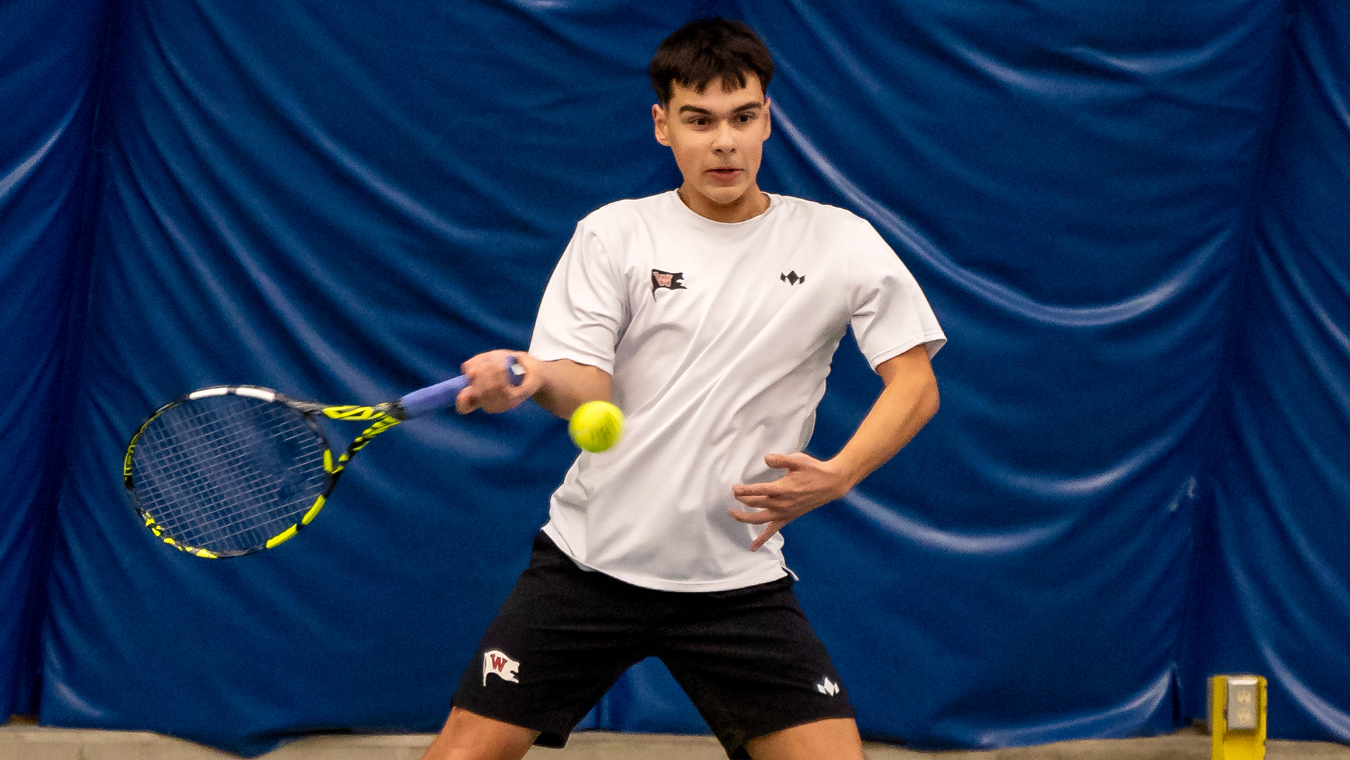 Matthew Morrison returns a serve vs. Whitman
