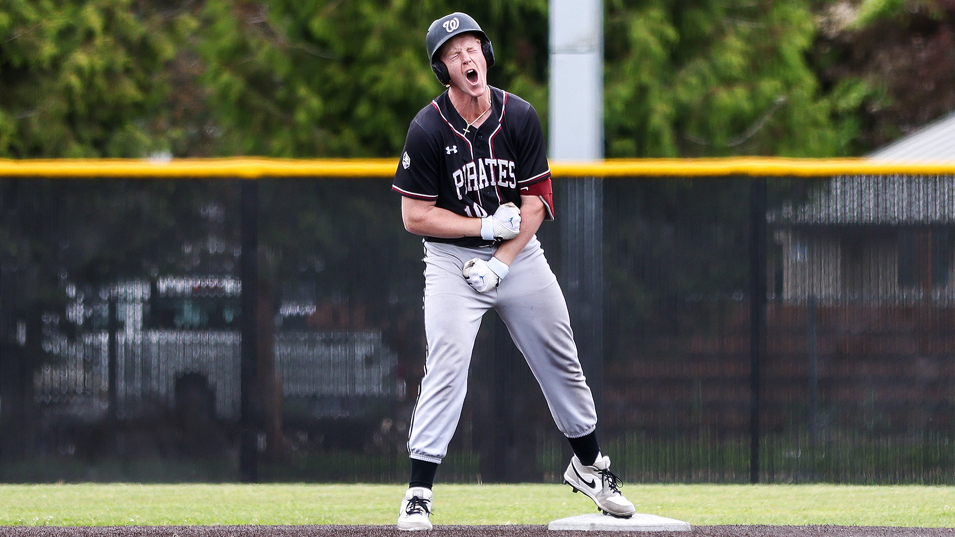 Caleb Gray celebrates his three-run double vs. Pacific at the NWC Tournament