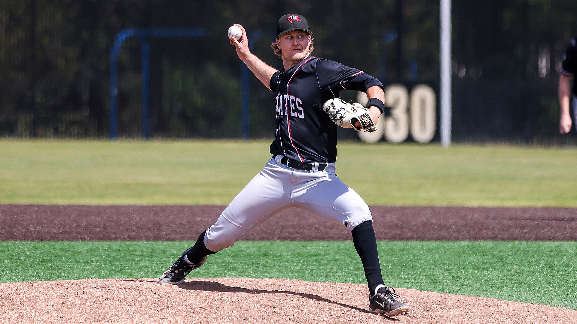 Dylan Huntsman pitches vs. Linfield at the NWC Tournament
