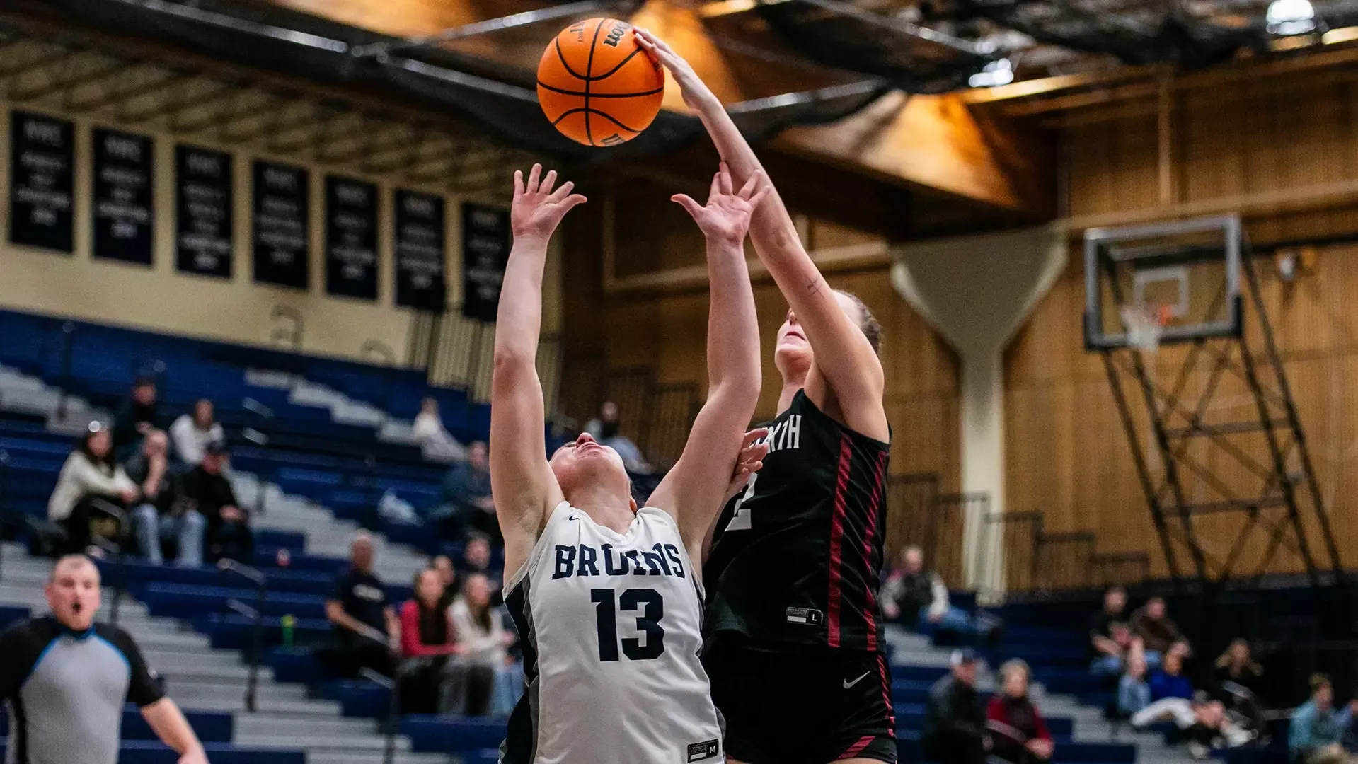 Ali Bush blocks a shot at George Fox 2025-26