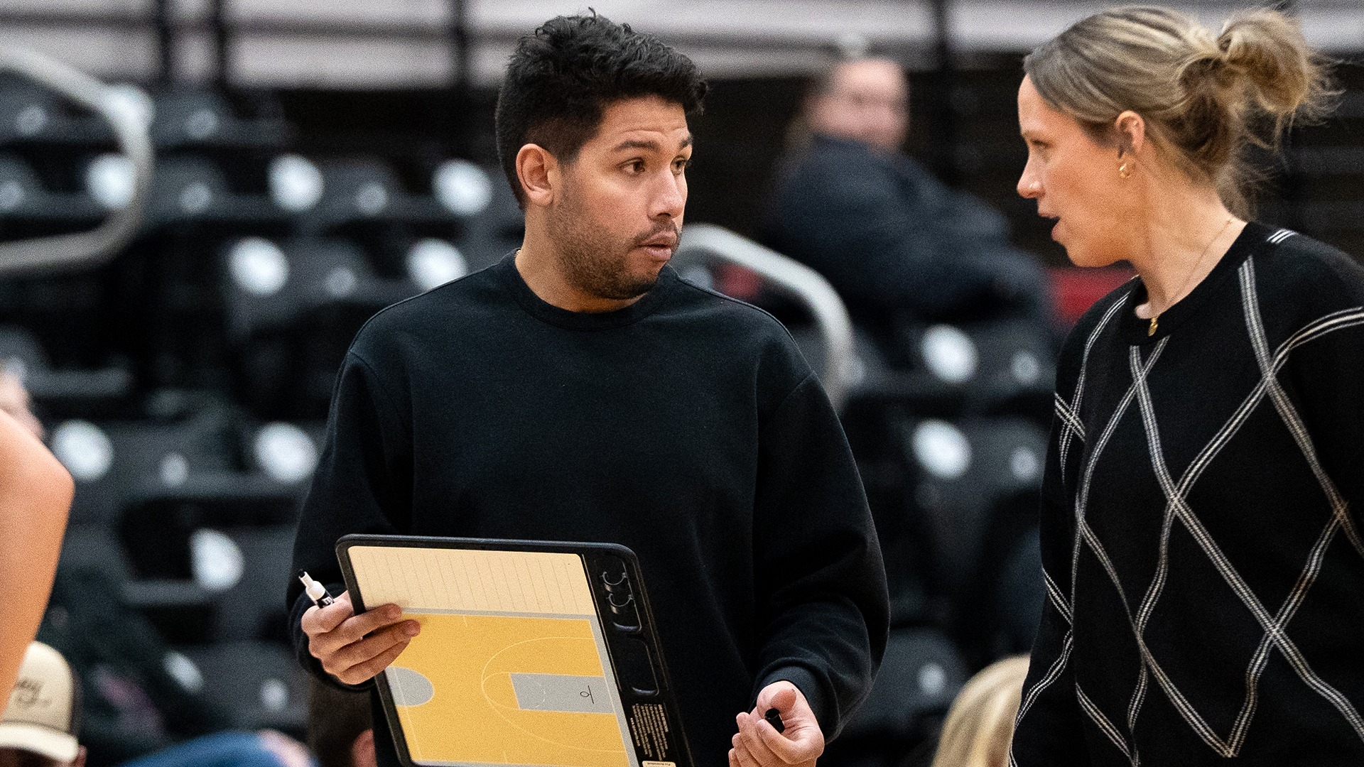 Kenny Love coaches with Lisa Faucette vs. PLU 2025-26