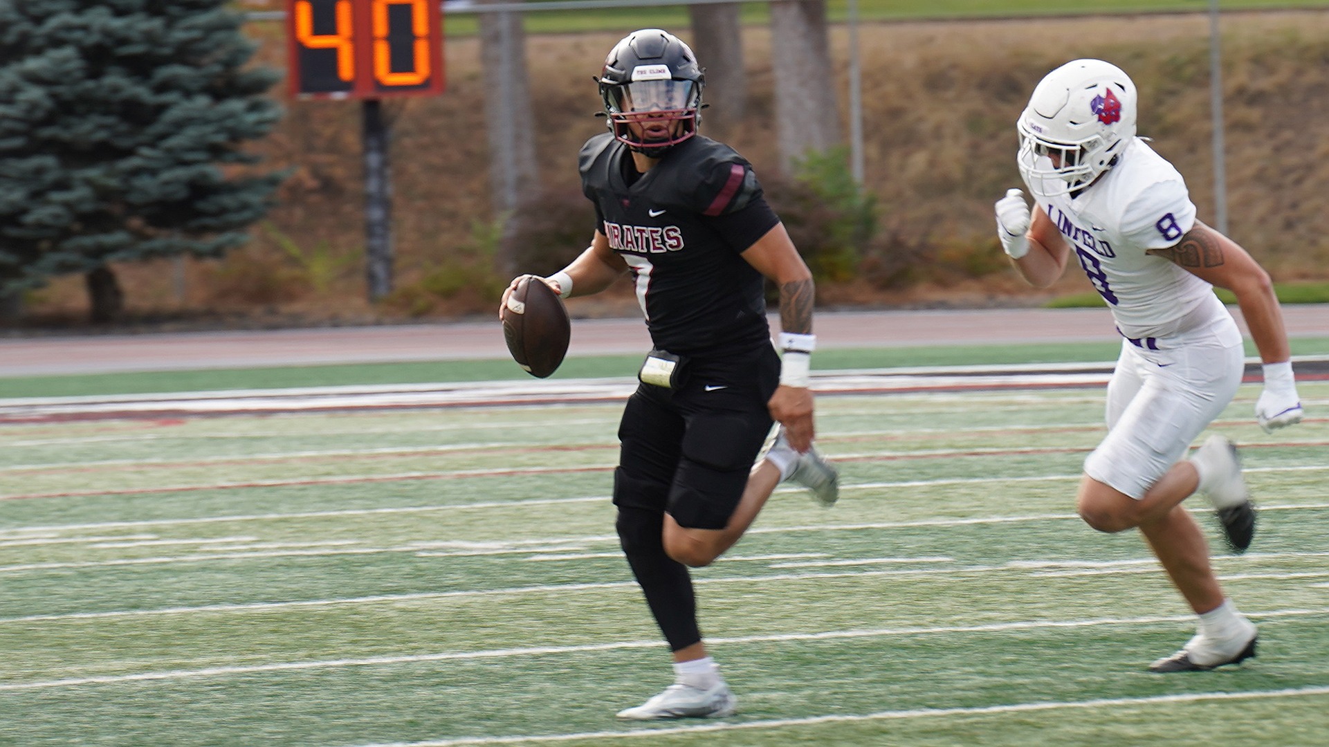 Logan Lacio looks downfield for an open Pirate vs. Linfield 2026