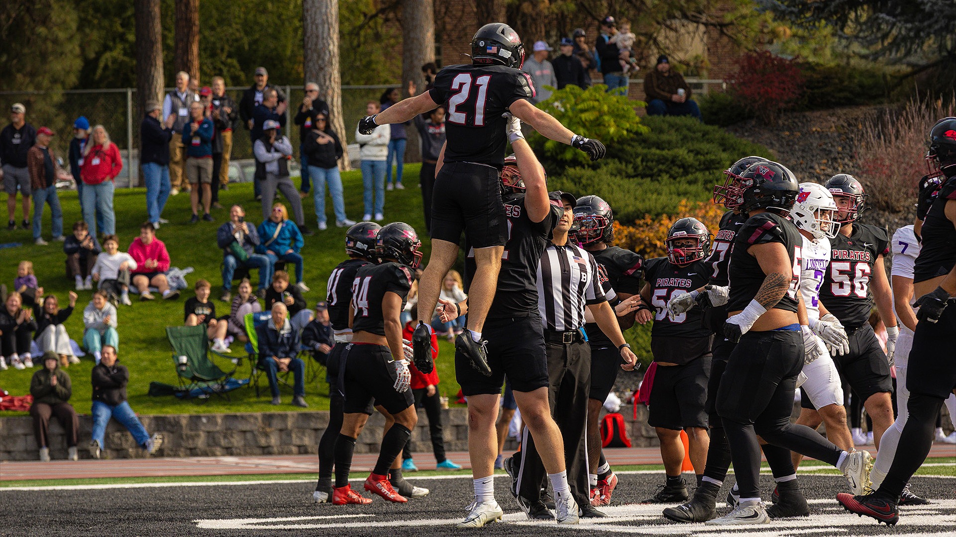 Grant Spillman and Evan Gaylord celebrate the Pirates' first touchdown vs. Linfield 2026