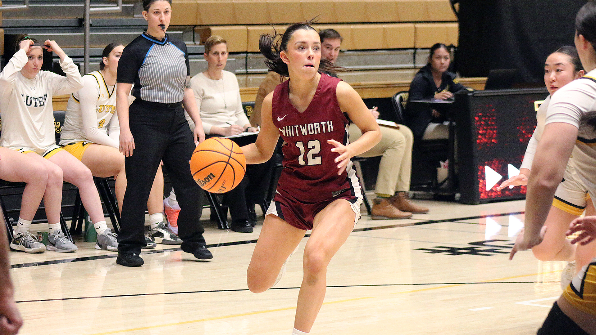 Ashlyn Peterson looks for an open teammate at PLU 2025-26