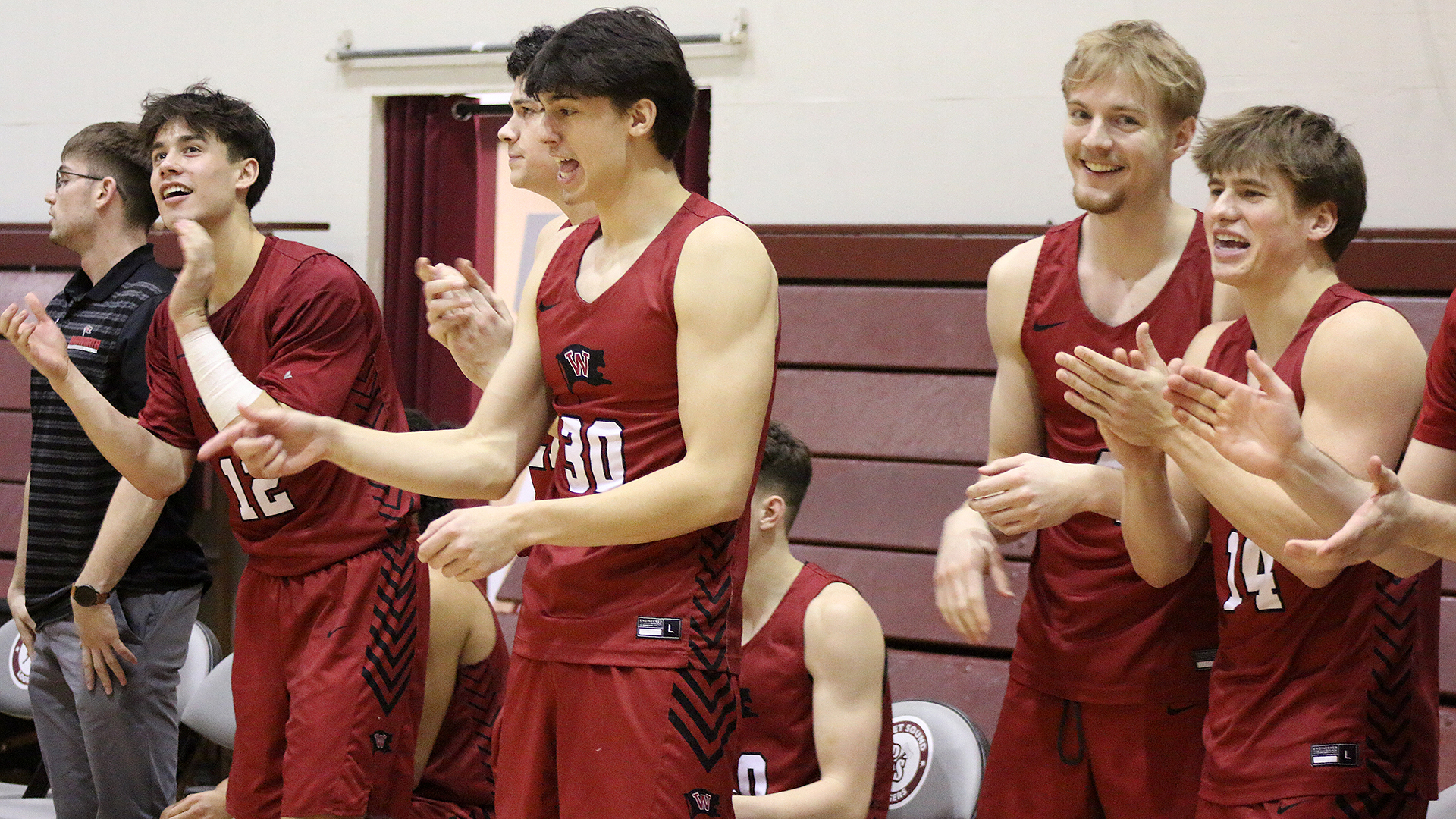 The bench reacts to a Pirate basket at Puget Sound 2025-26