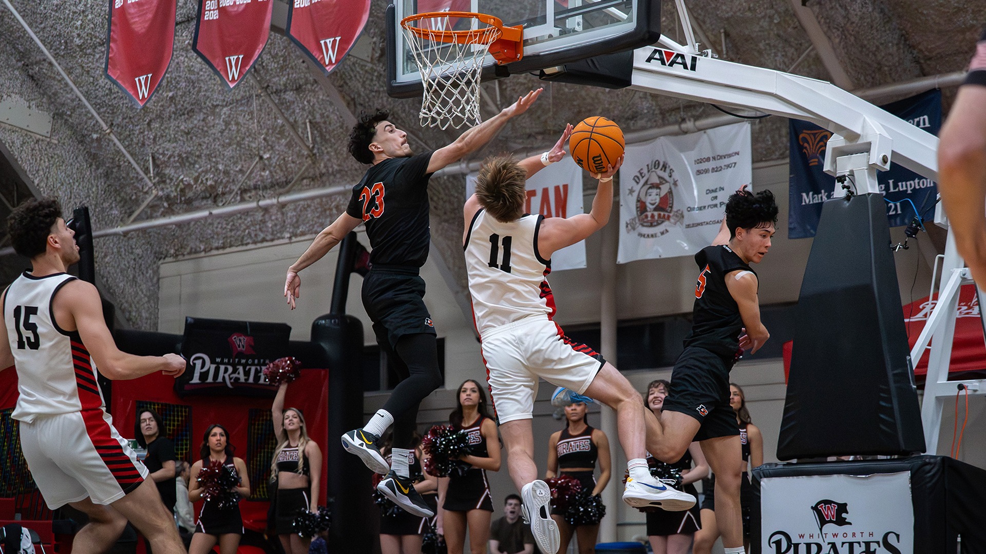 Ben Nyquist drives for two of his 20 points vs. L&C in NWC semifinal 2025-26