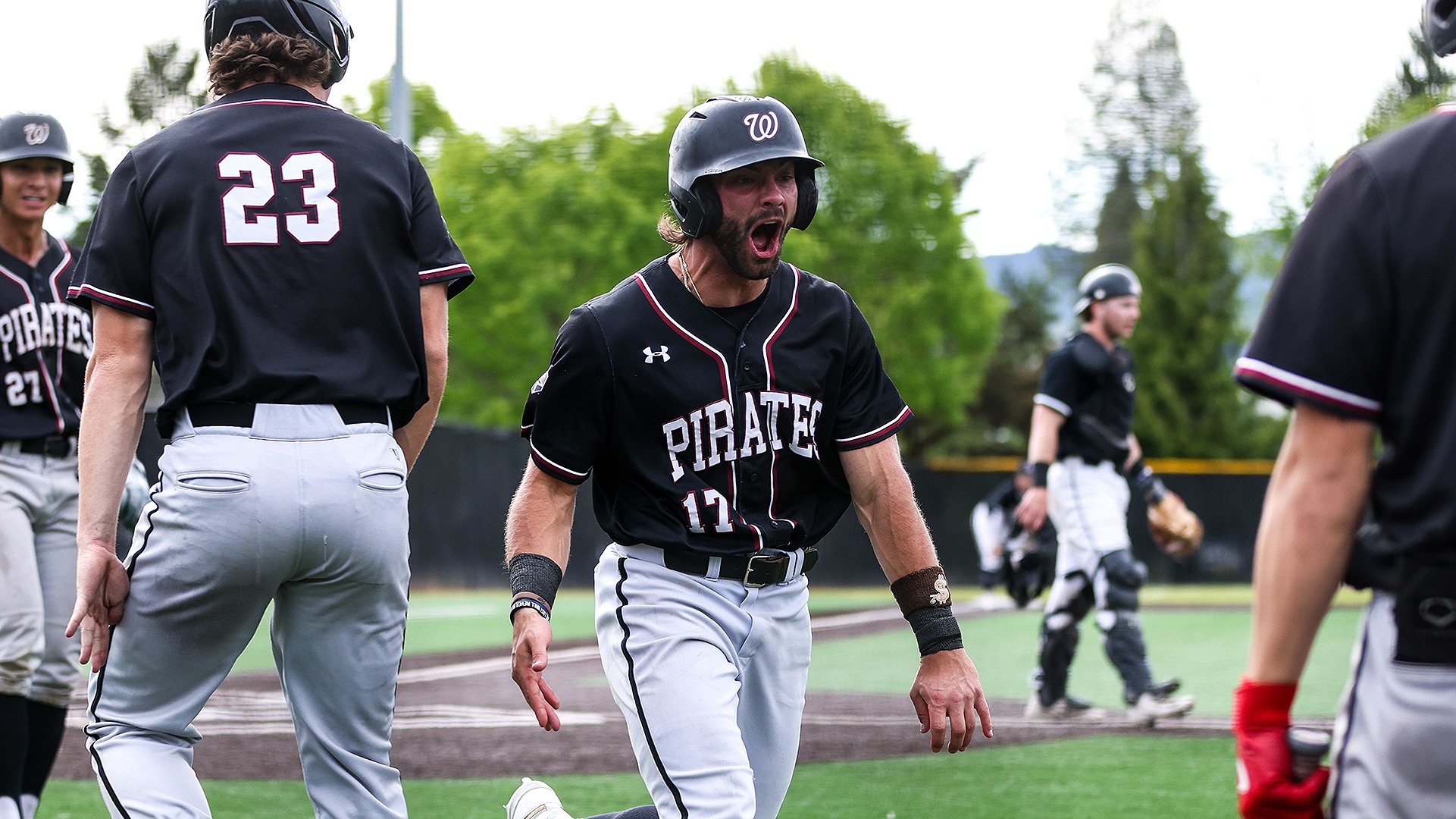 Spencer Shipman celebrates scoring an important run at NWC Tournament Final 2025