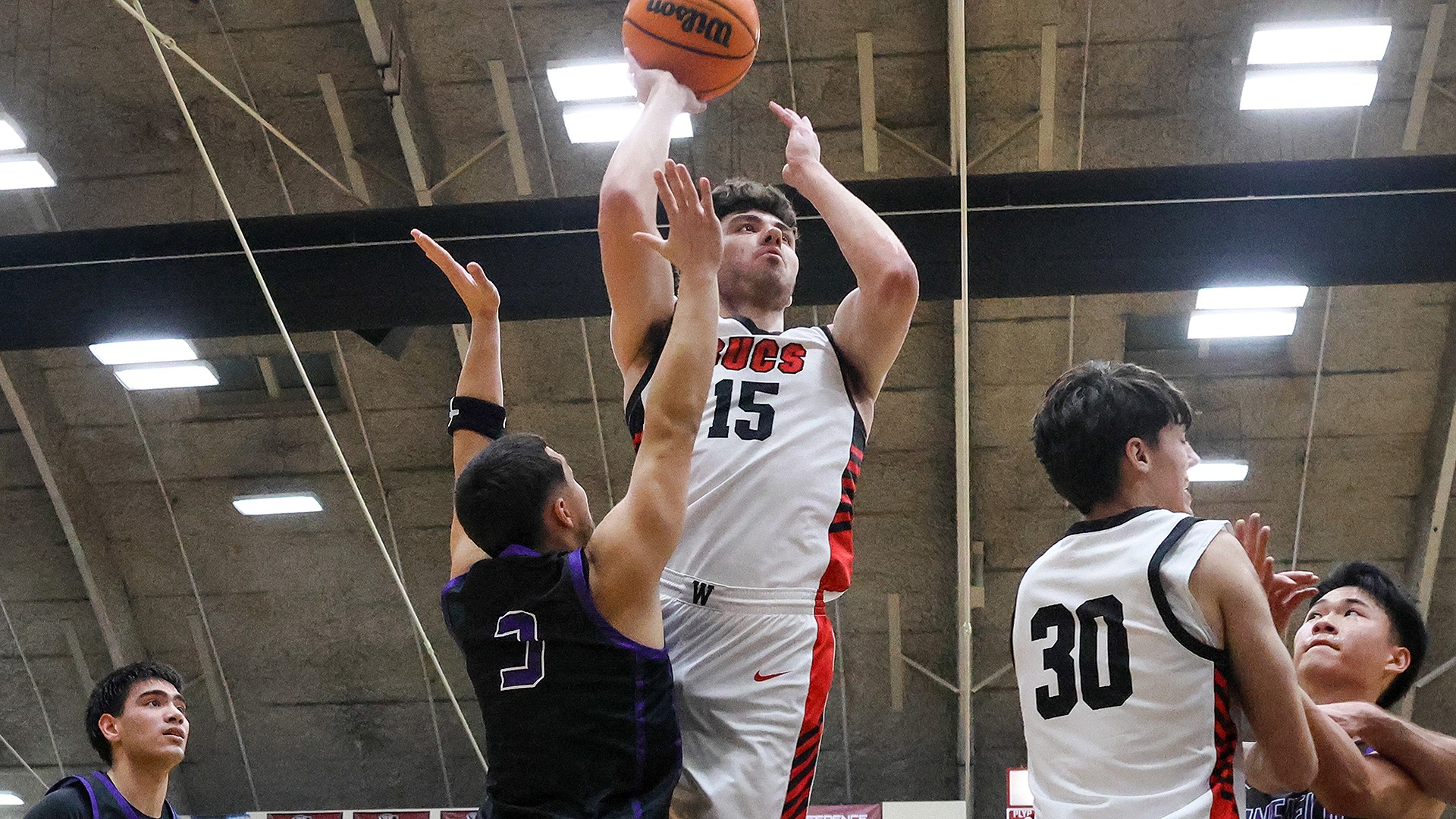 Stephen Behil raises for two of his nine first half points vs. Linfield 2025-26