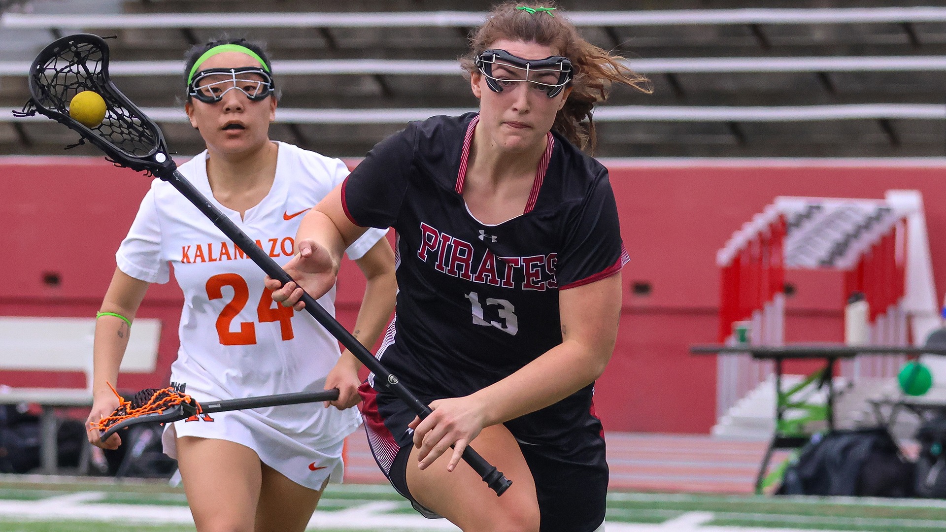 Megan Whitman drives upfield vs. Kalamazoo 2026