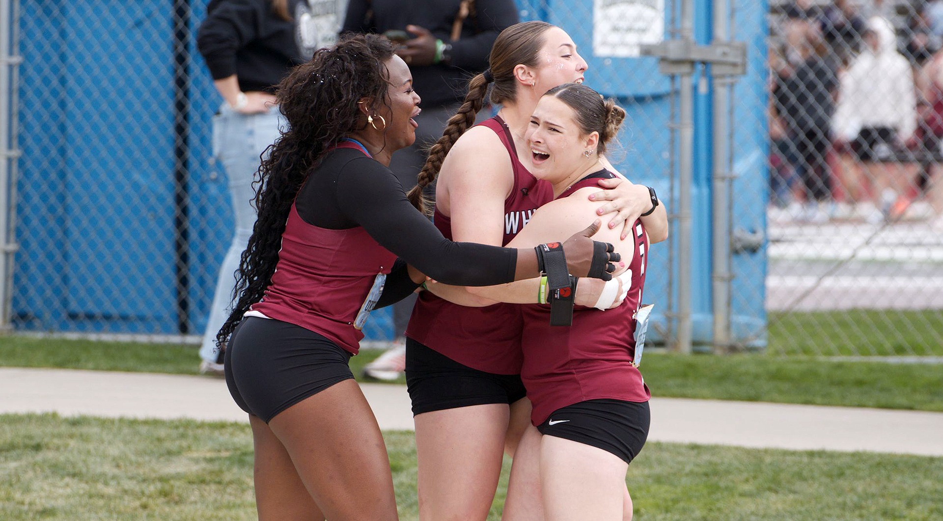 Amblessed Okemgbo, Madison Carr and Kylie Loveless celebrate a 1-2-3 finish in the women's shot put at 2026 NWC T&F Championships
