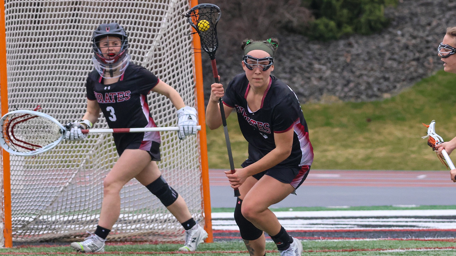 Jordyn Bennett looks for an opening to clear the ball vs. Kalamazoo 2026