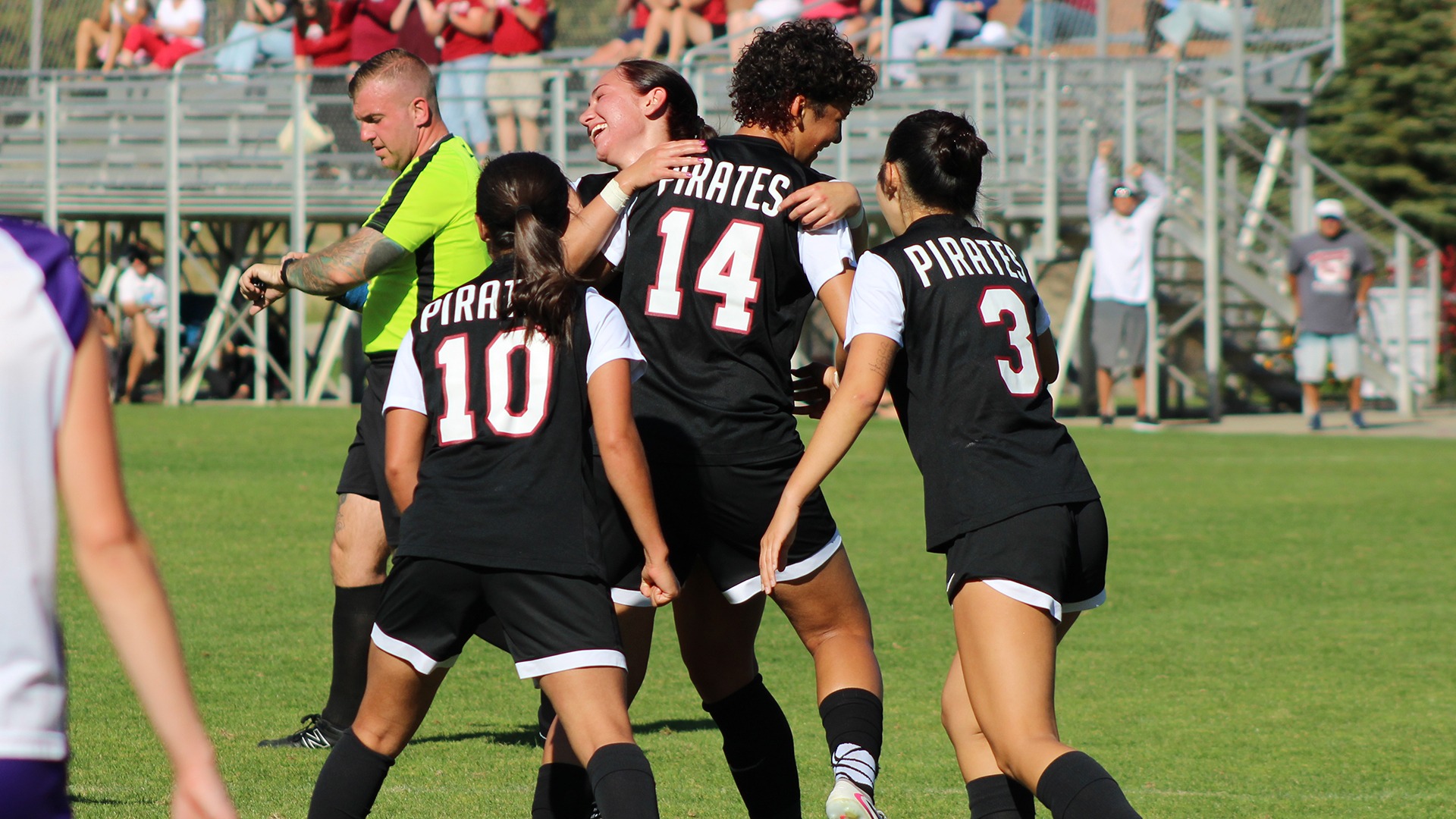 The Pirates celebrate a goal by Sylvie Washington vs. Linfield 2026