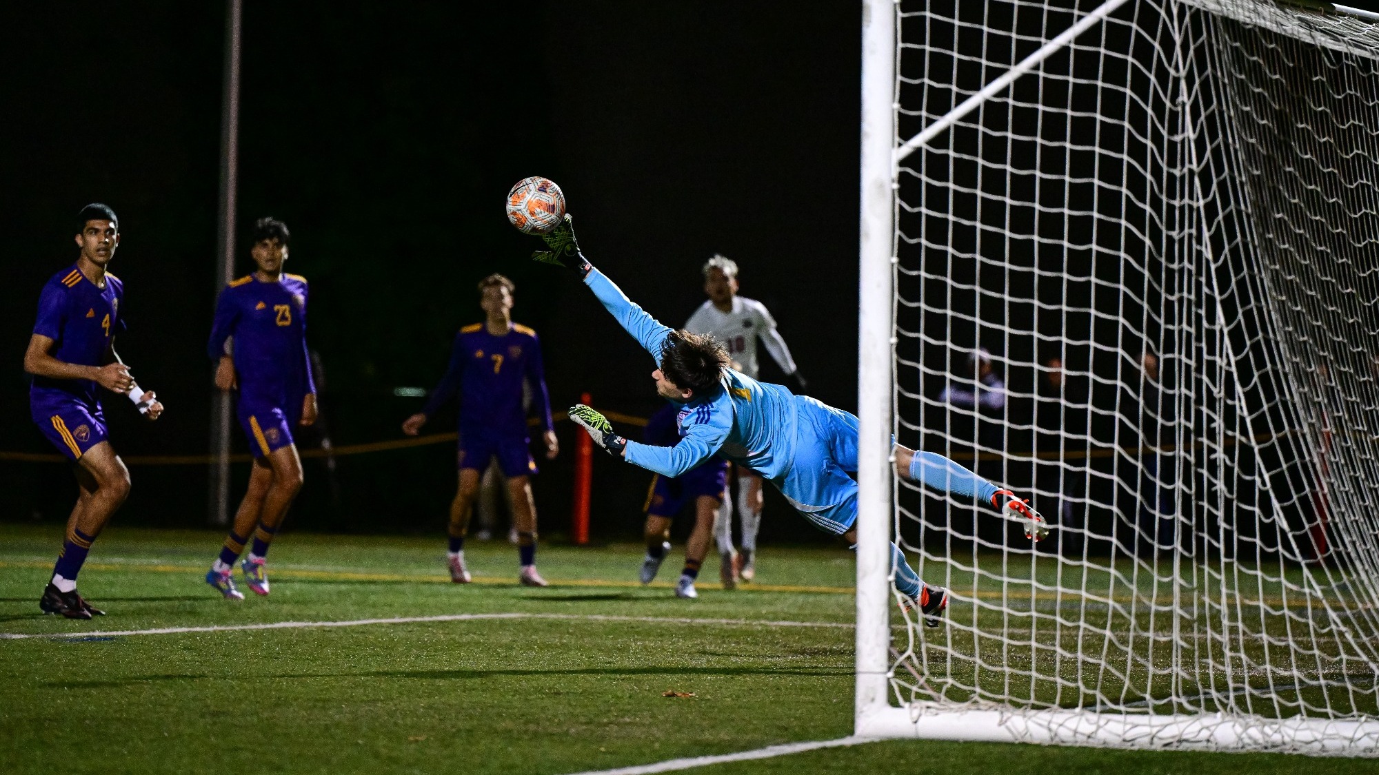 David Carano makes a spectacular fingertip save against Brock.