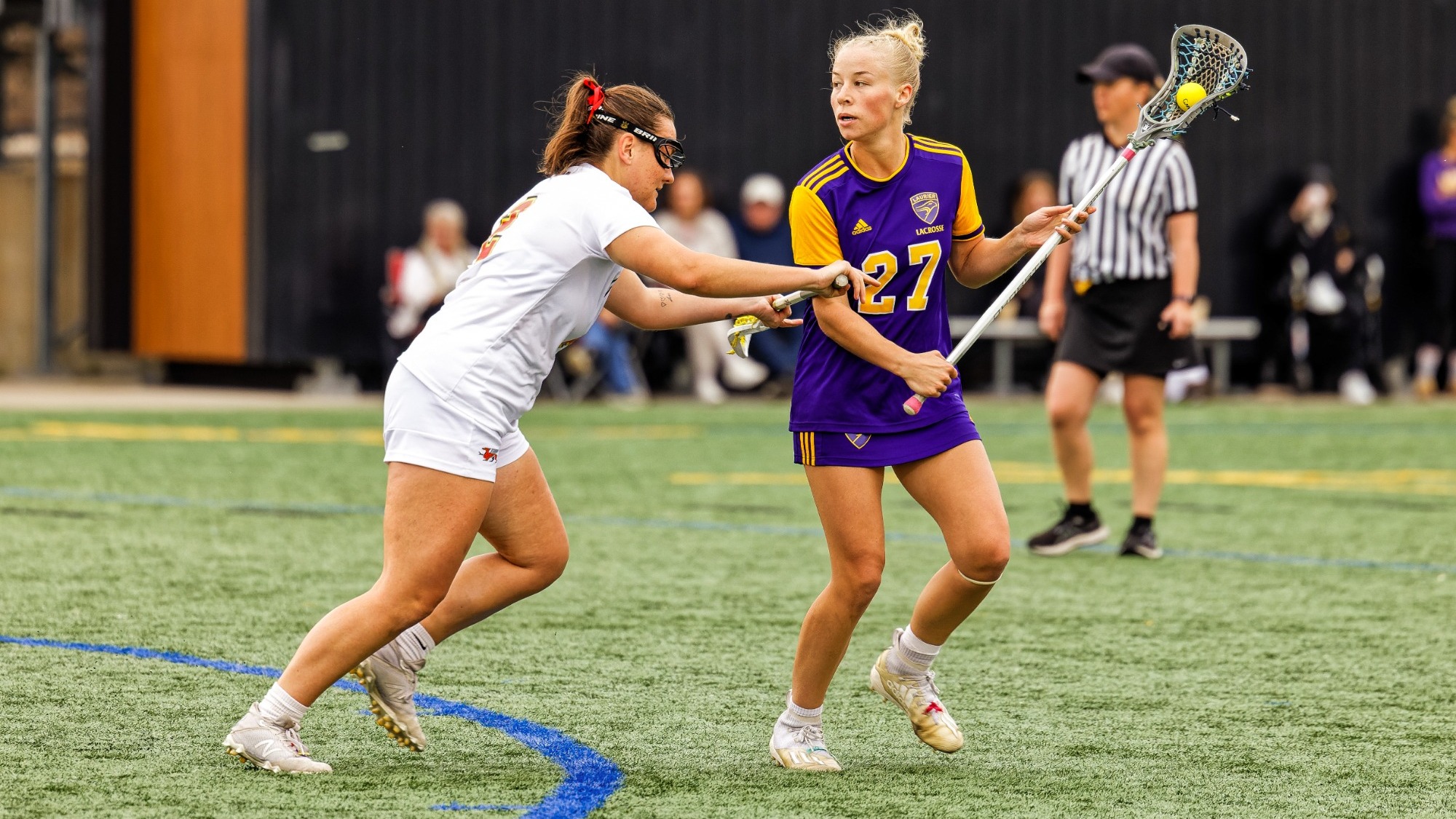 Tieneke Gedge keeps the ball away from a Guelph defender.