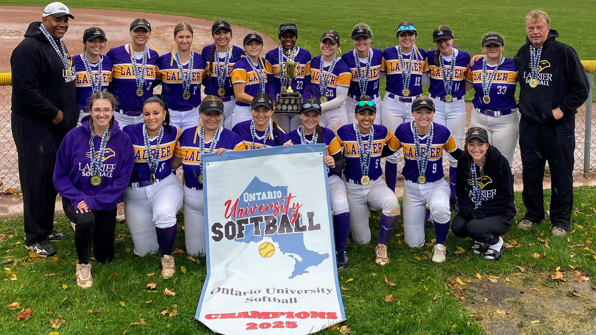 The Laurier women's softball team poses with their 2025 provincial gold medals.