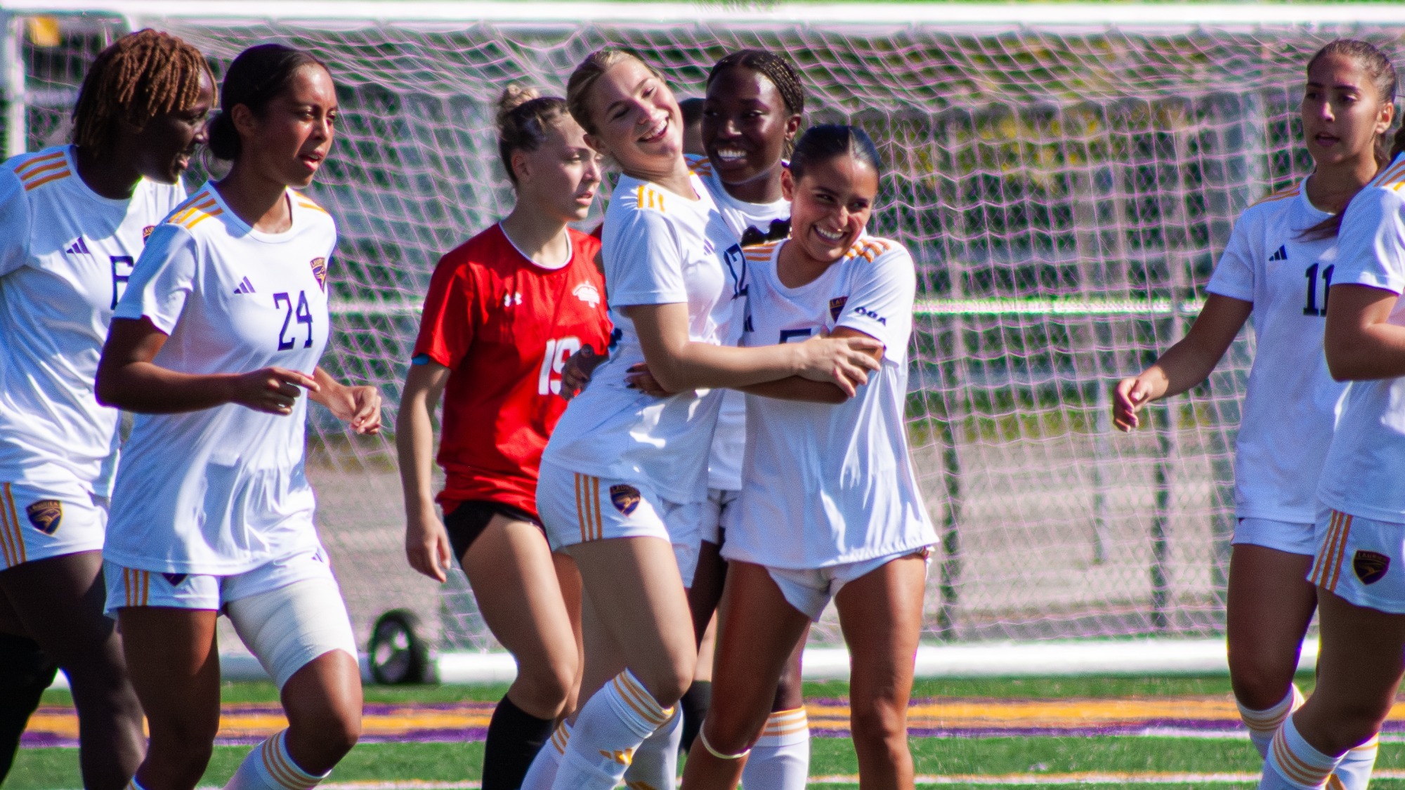 Laurier celebrate a goal against Algoma
