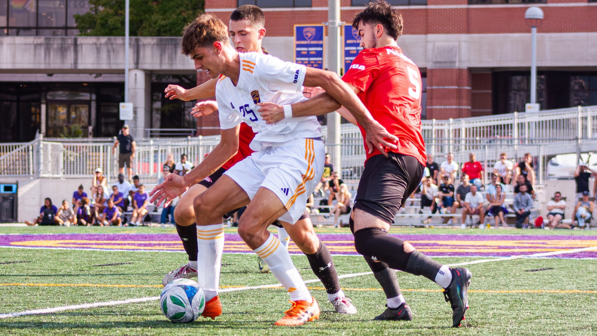 Maksym Telishchuk tries to get out of the grips of Algoma defenders.