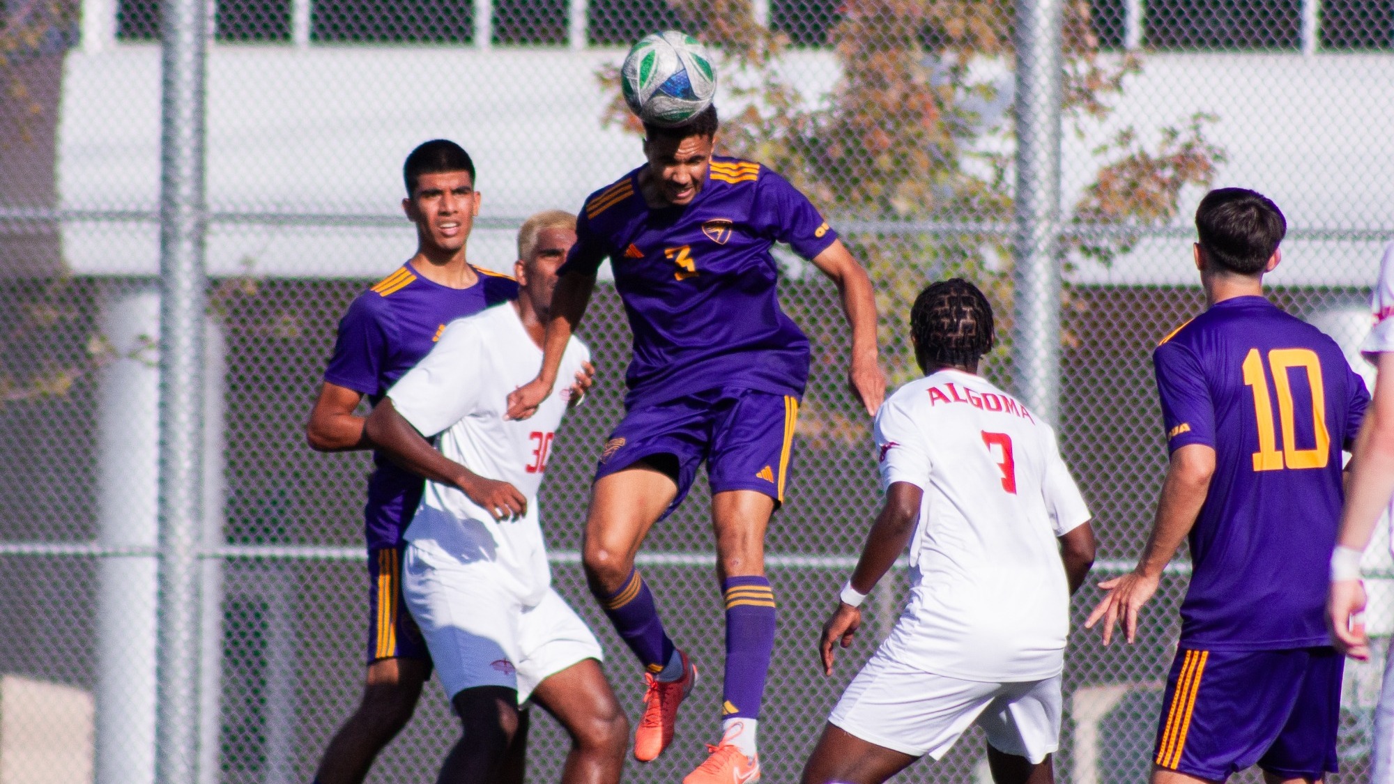 Laurier rise for a header against Algoma.