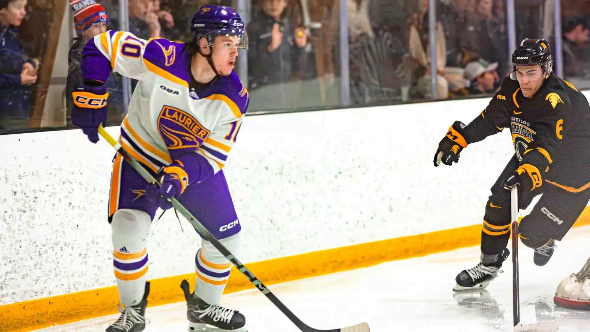 Ty Petrou looks to pass the puck from behind the net against Waterloo.