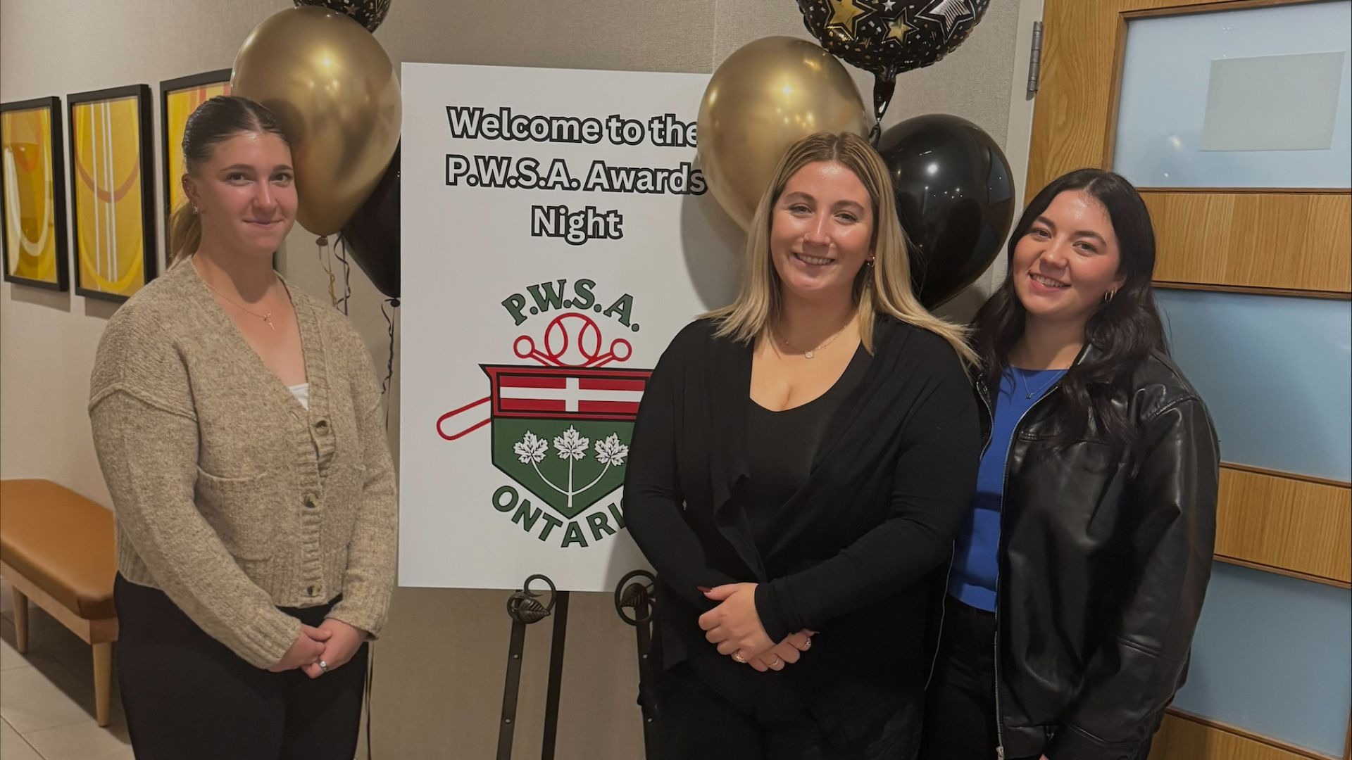 Laurier women's softball accepts their scholarship award