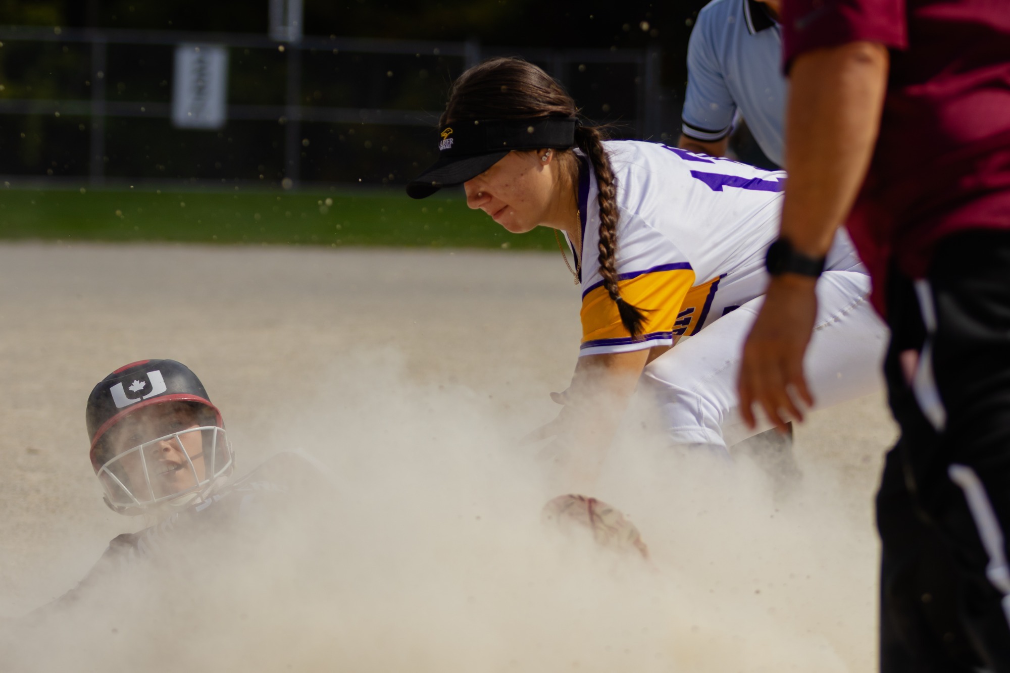 An opposing player slides during a match against the Laurier women's softball team 