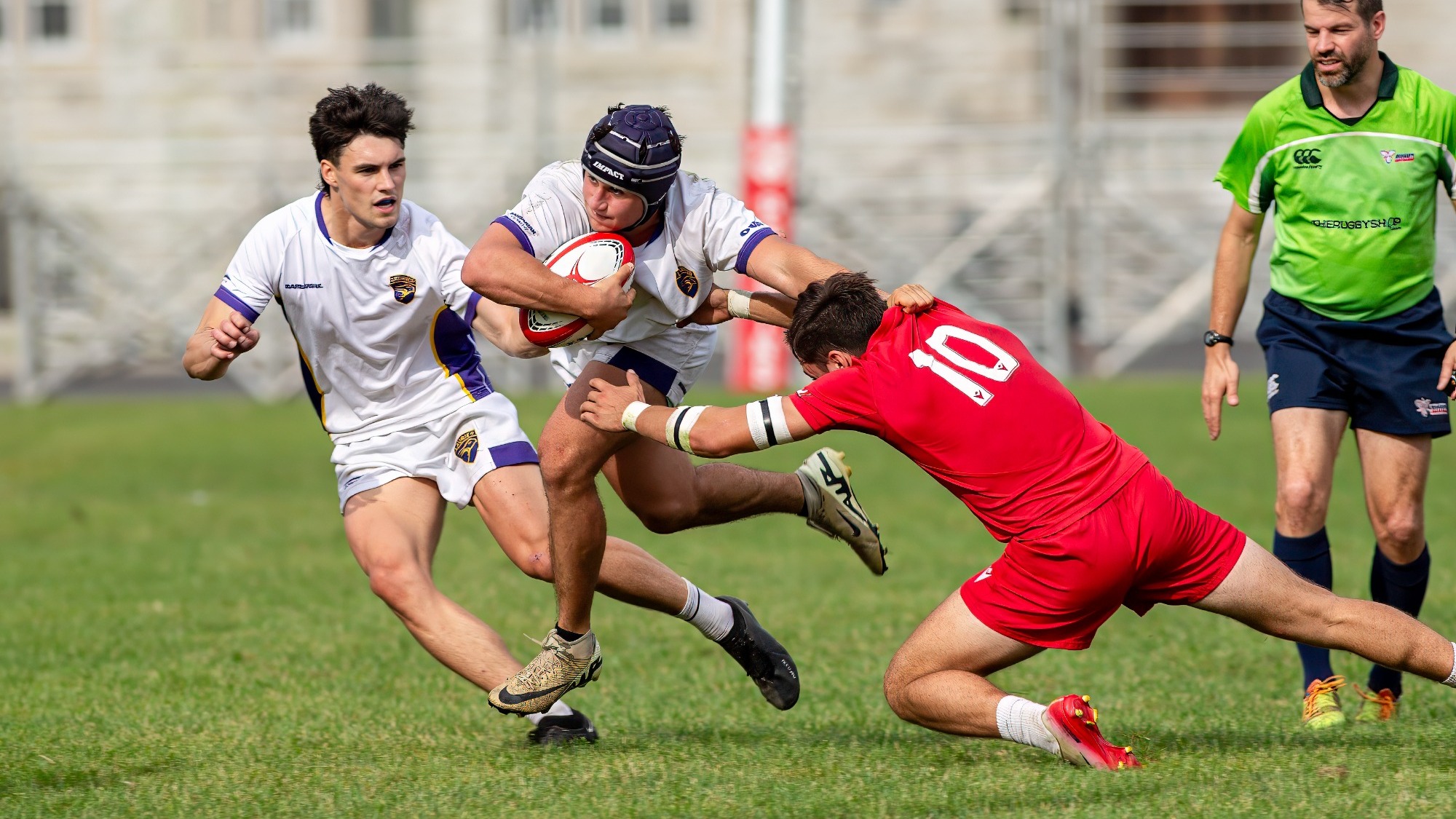 Laurier men's rugby pushes away an RMC defender.