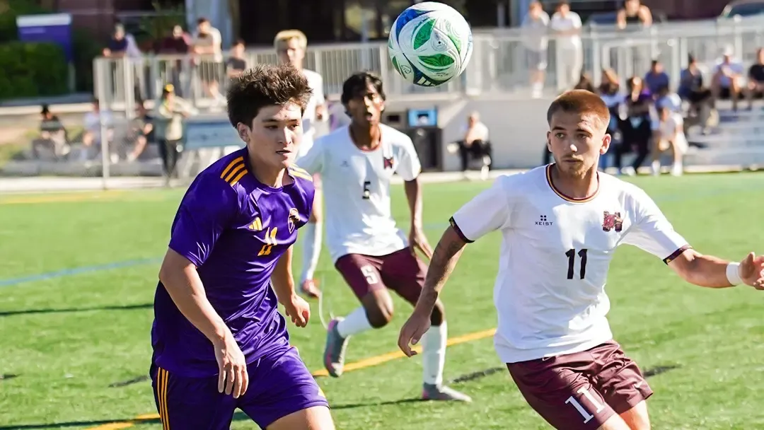 Laurier and McMaster chase after a loose ball.