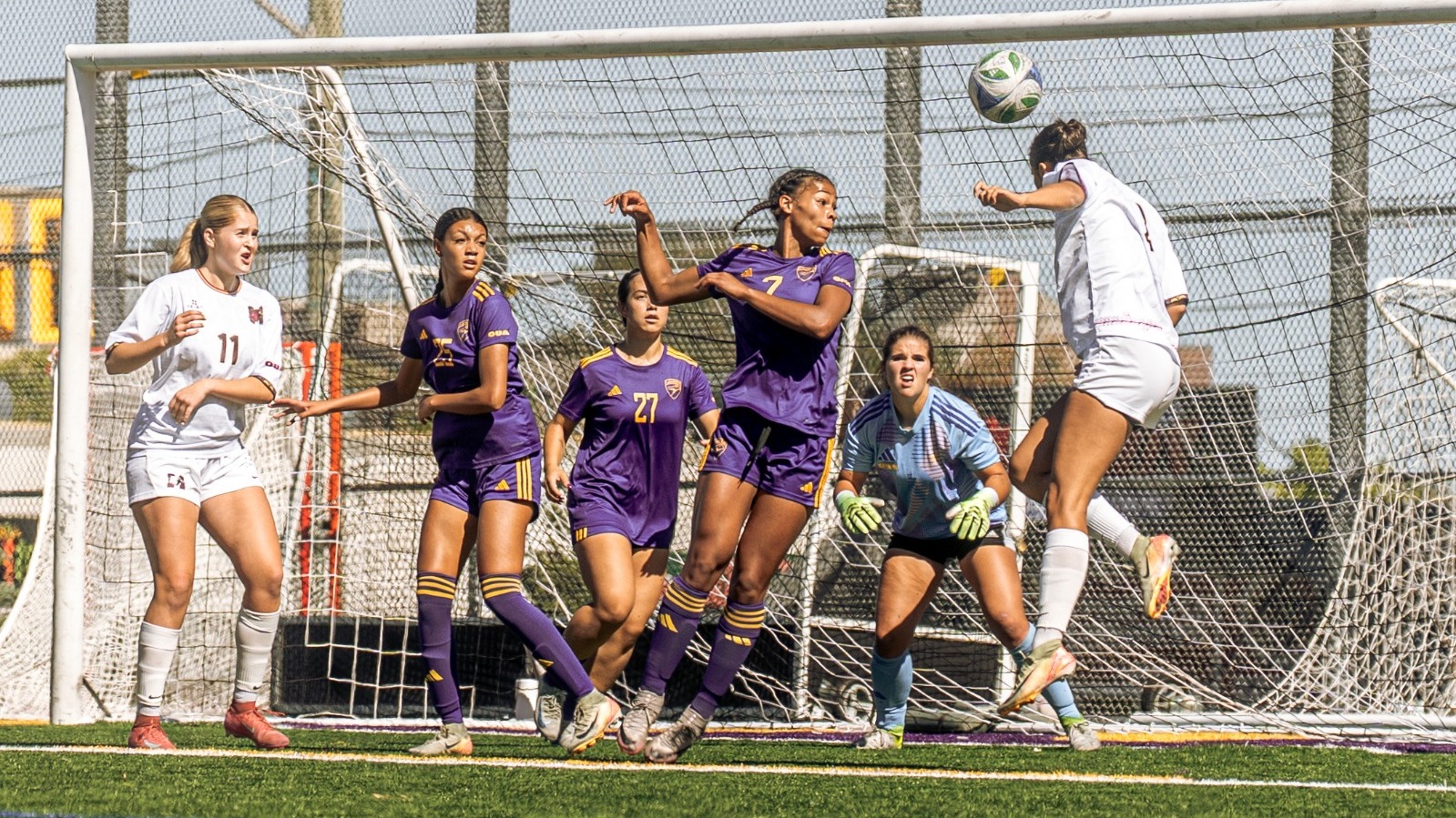 McMaster flicks a header towards Laurier's goalkeeper