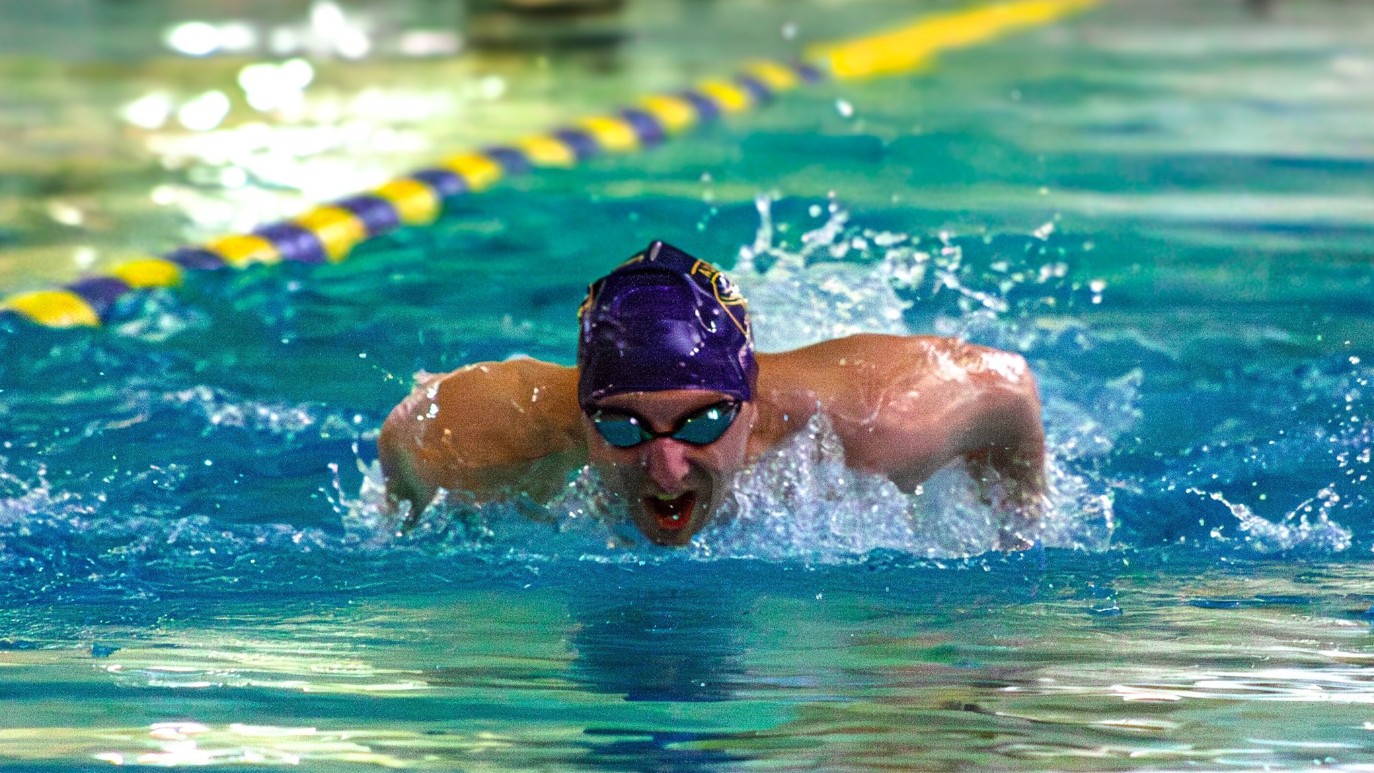 Laurier men's swimmer competes in a race.