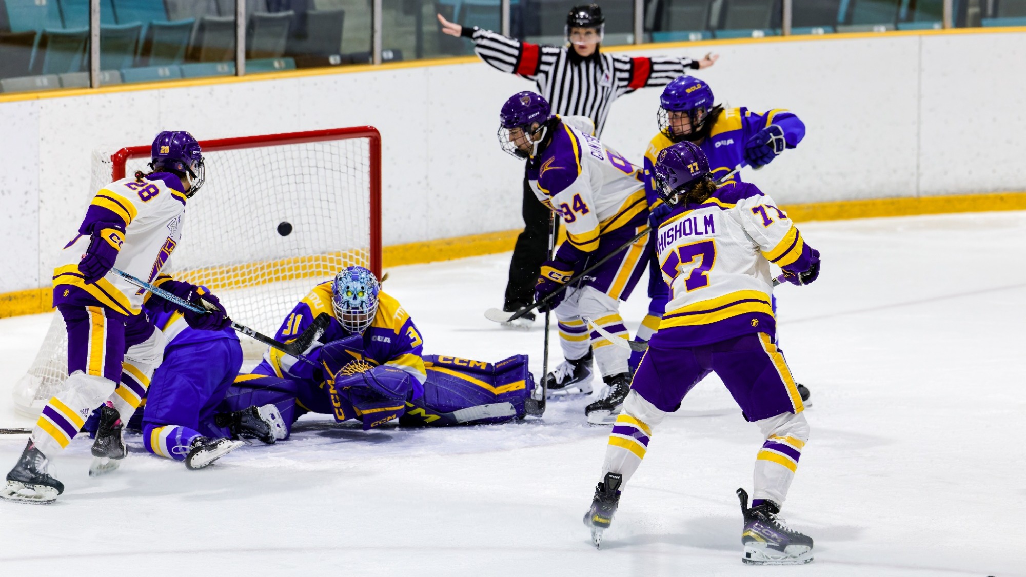 Laurier tries to score on a goal mouth scramble against TMU