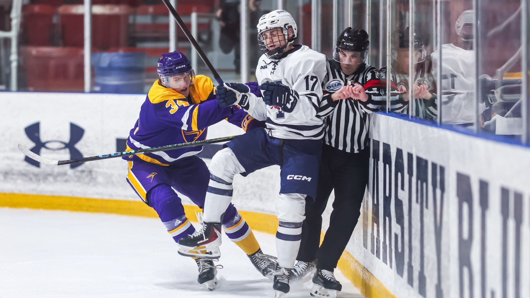 Laurier pins Toronto and the referee against the boards