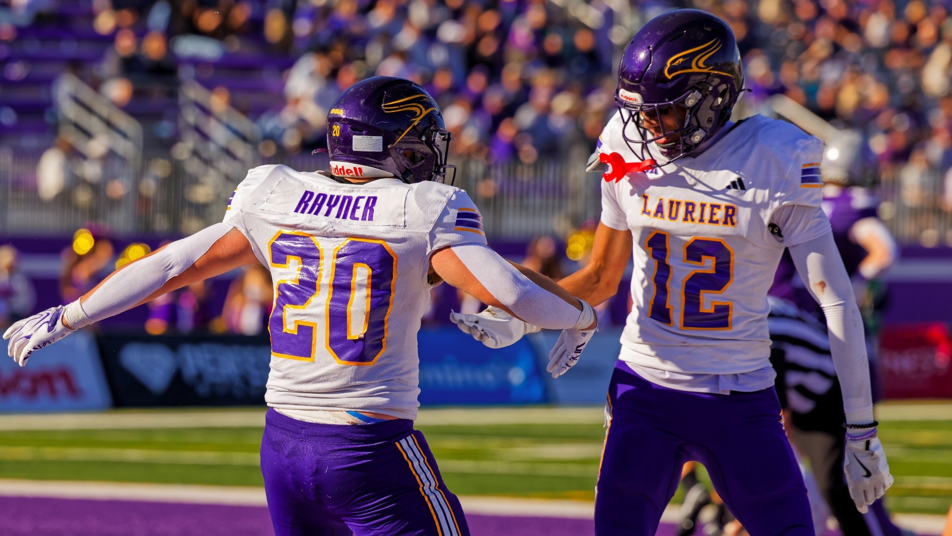 Rayner and Robinson celebrate a touchdown against Western.