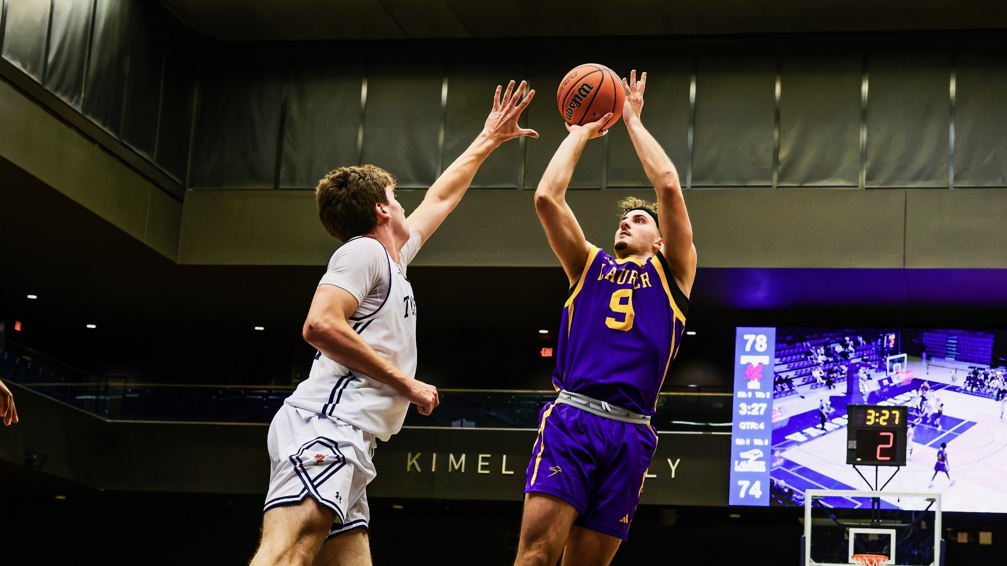 Laurier takes a jumper over a Toronto defender.