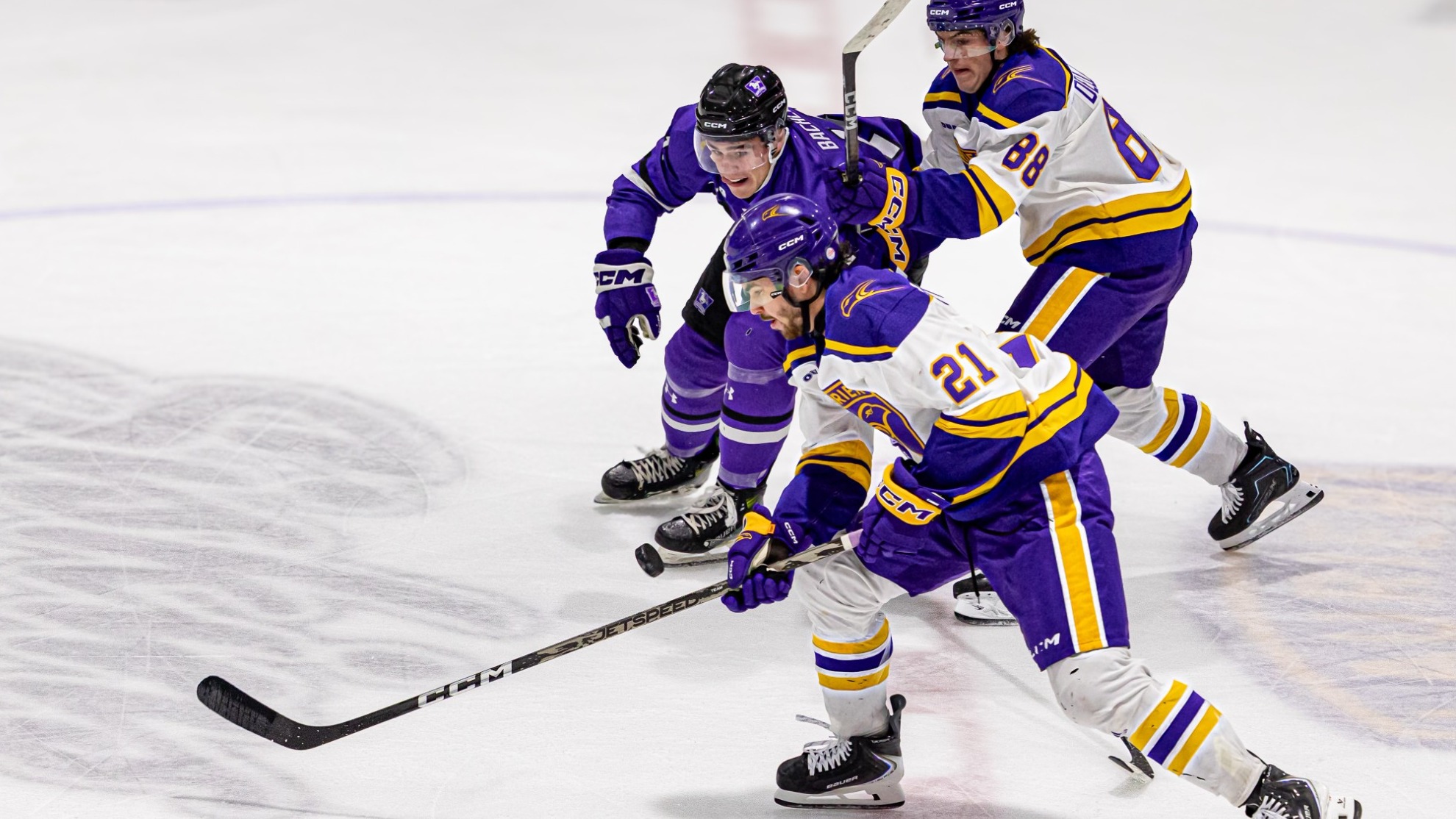 Laurier rushes up ice at home against Western.